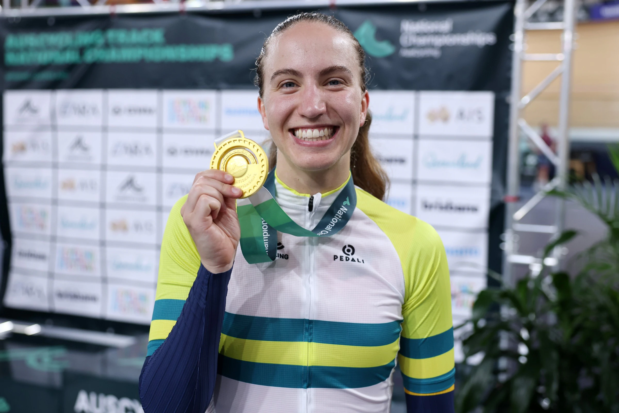 Sophie Edwards with gold medal and green and gold national champion's jersey for the elite women's individual pursuit at the 2026 AusCycling Track National Championships at Anna Meares Velodrome, Brisbane, Queensland.