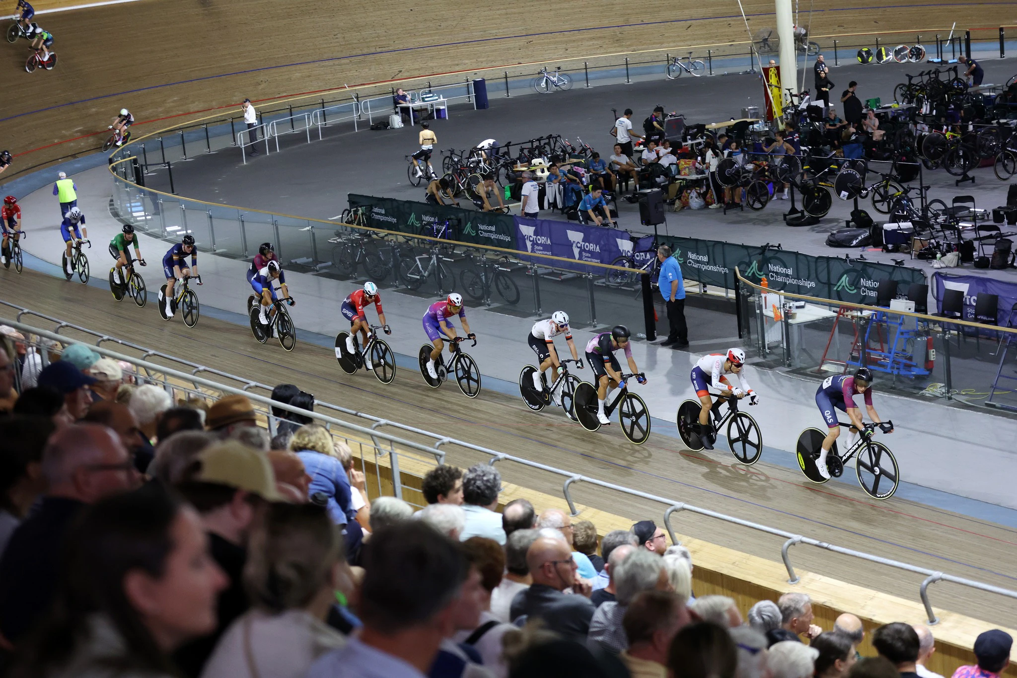 Men racing the 2024 AusCycling Madison National Championships at Joe Ciavola Velodrome (DISC) in Melbourne while crowd watches on. Picture: Con Chronis