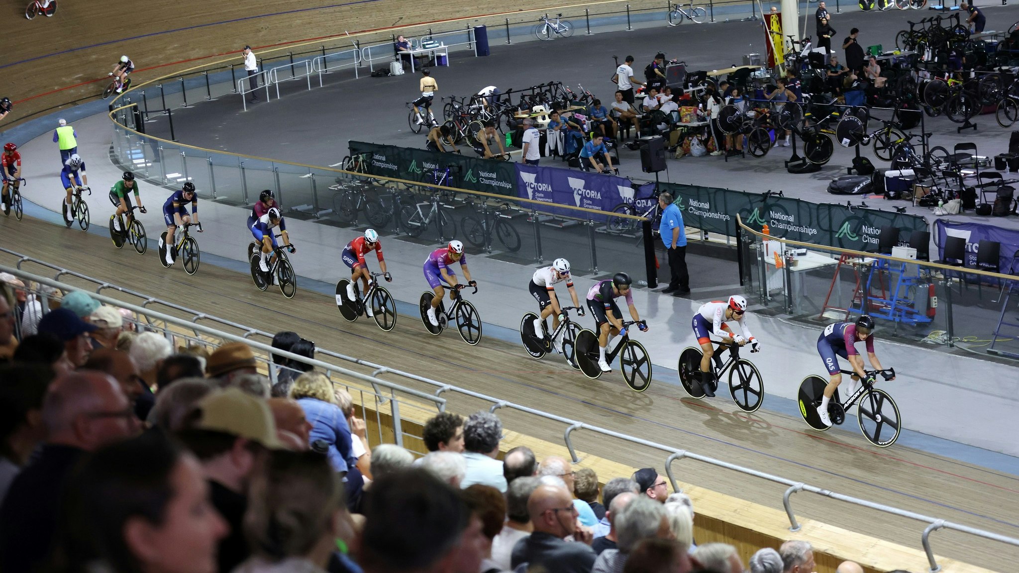 Men racing the 2024 AusCycling Madison National Championships at Joe Ciavola Velodrome (DISC) in Melbourne while crowd watches on. Picture: Con Chronis