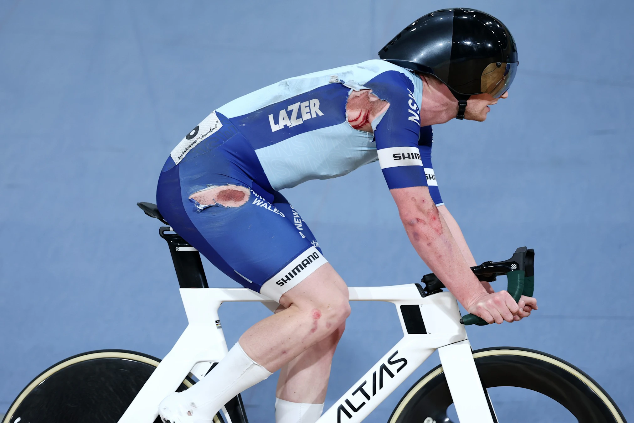 NSW cyclist Tom Cornish races in a torn New South Wales skinsuit after crashing in the elite men elimination race at the 2026 AusCycling Track National Championships at the Anna Meares Velodrome in Brisbane.