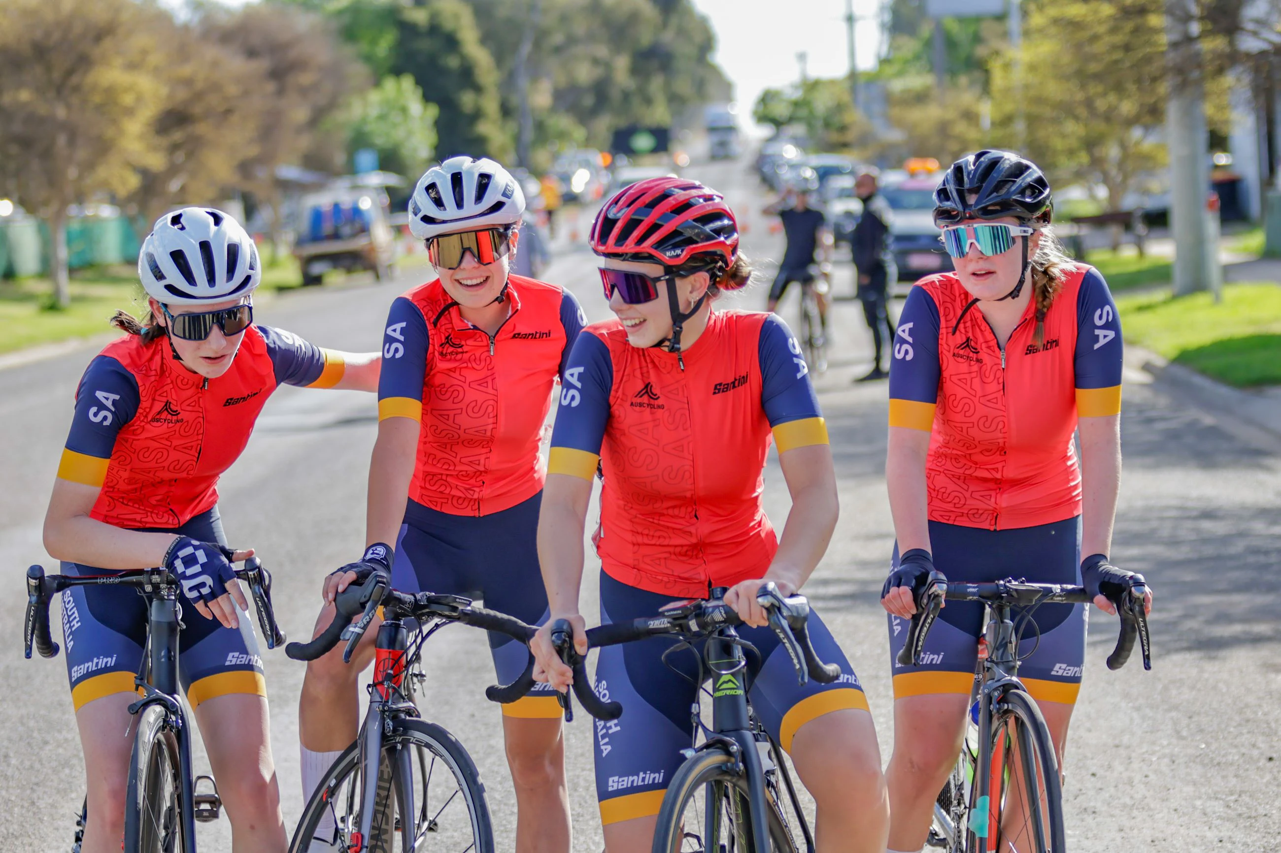 Four South Australian junior women cyclists celebrate together after a race at the 2023 AusCycling Junior National Road Championships in Shepparton