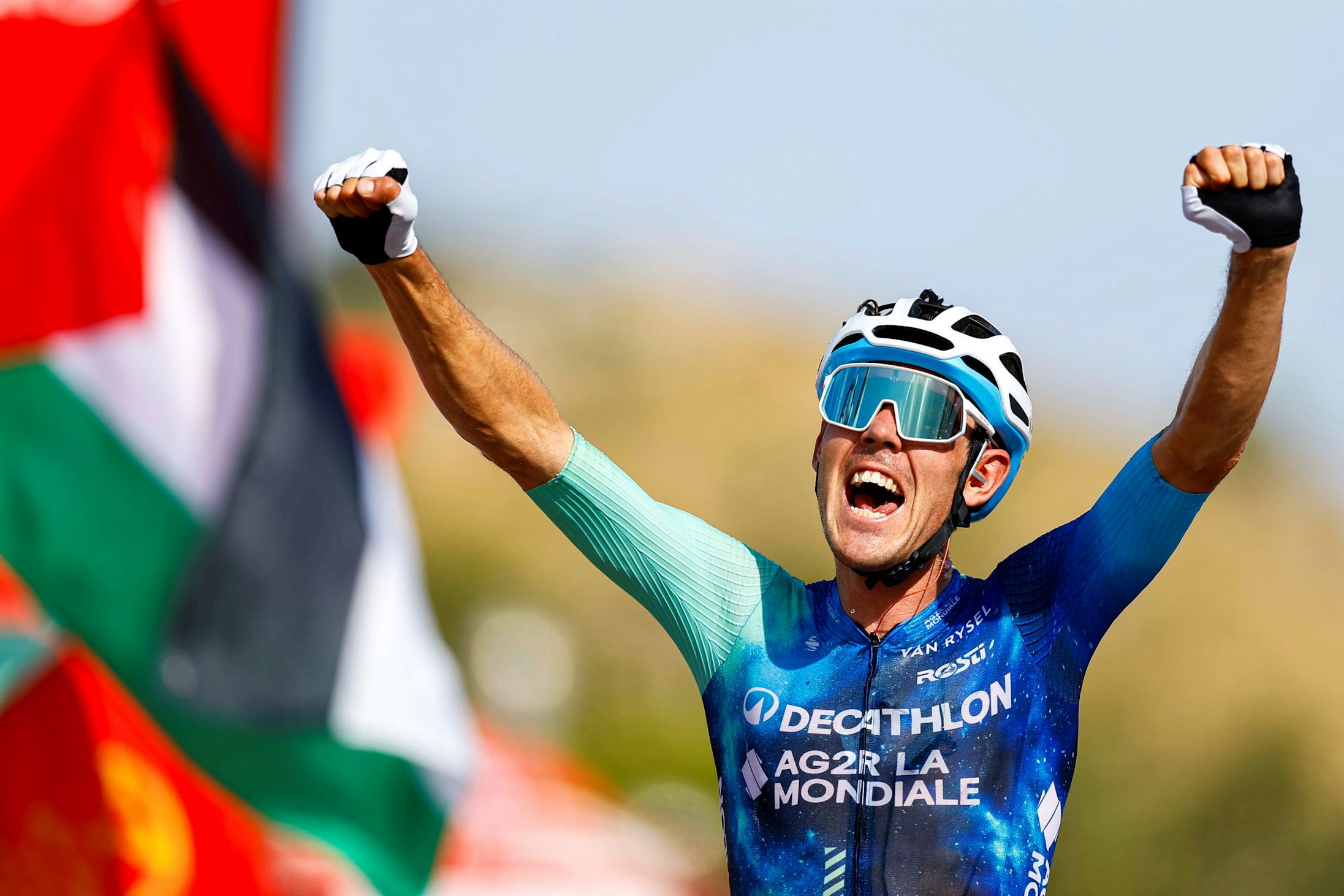 West Australian cyclist Ben O'Connor roars with delight after winning stage 6 of the 2024 Vuelta a Espana