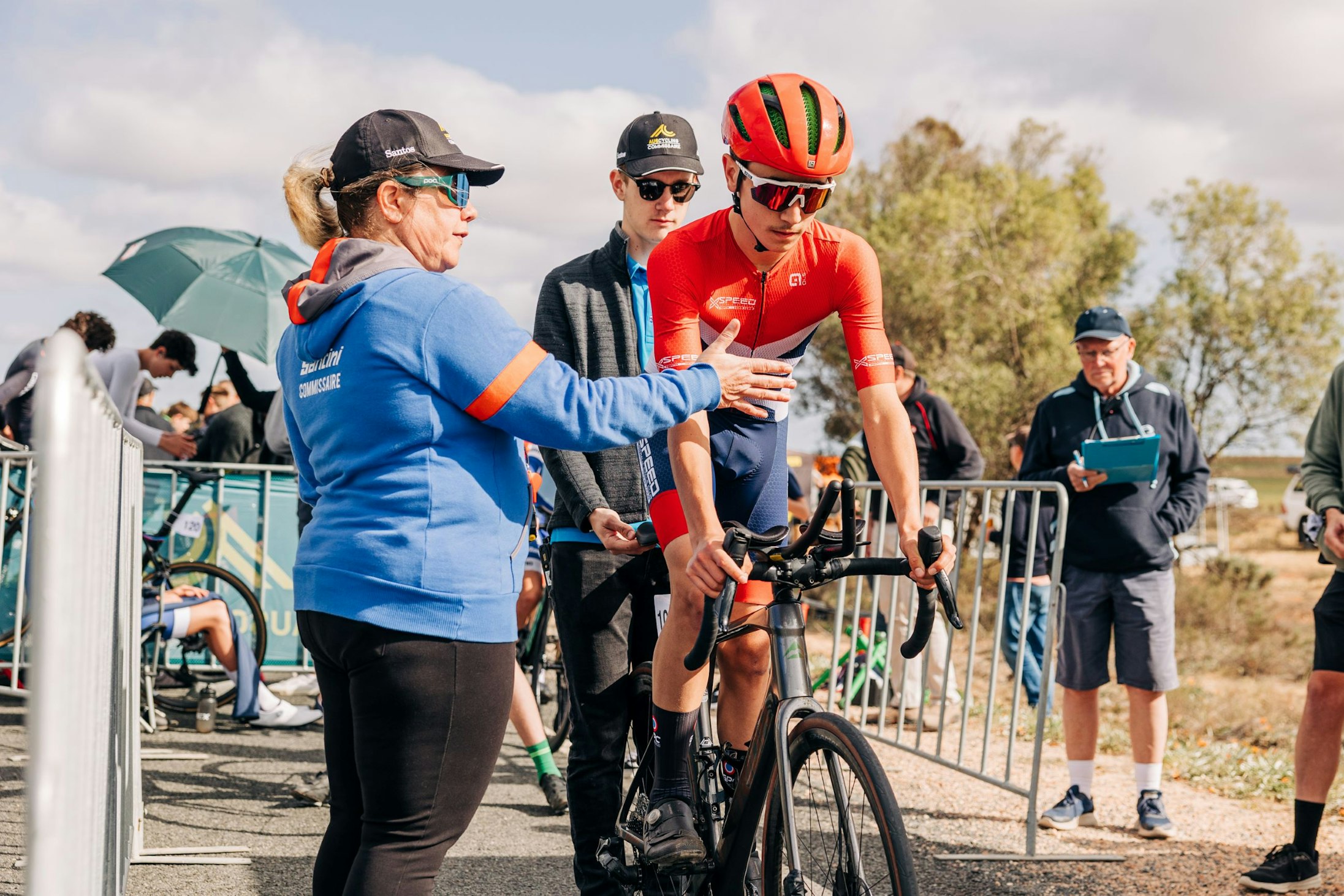 A junior cyclist gets the countdown from the commissaire to start his time trial at the 2024 AusCycling Masters and Junior Road National Championships in Loxton