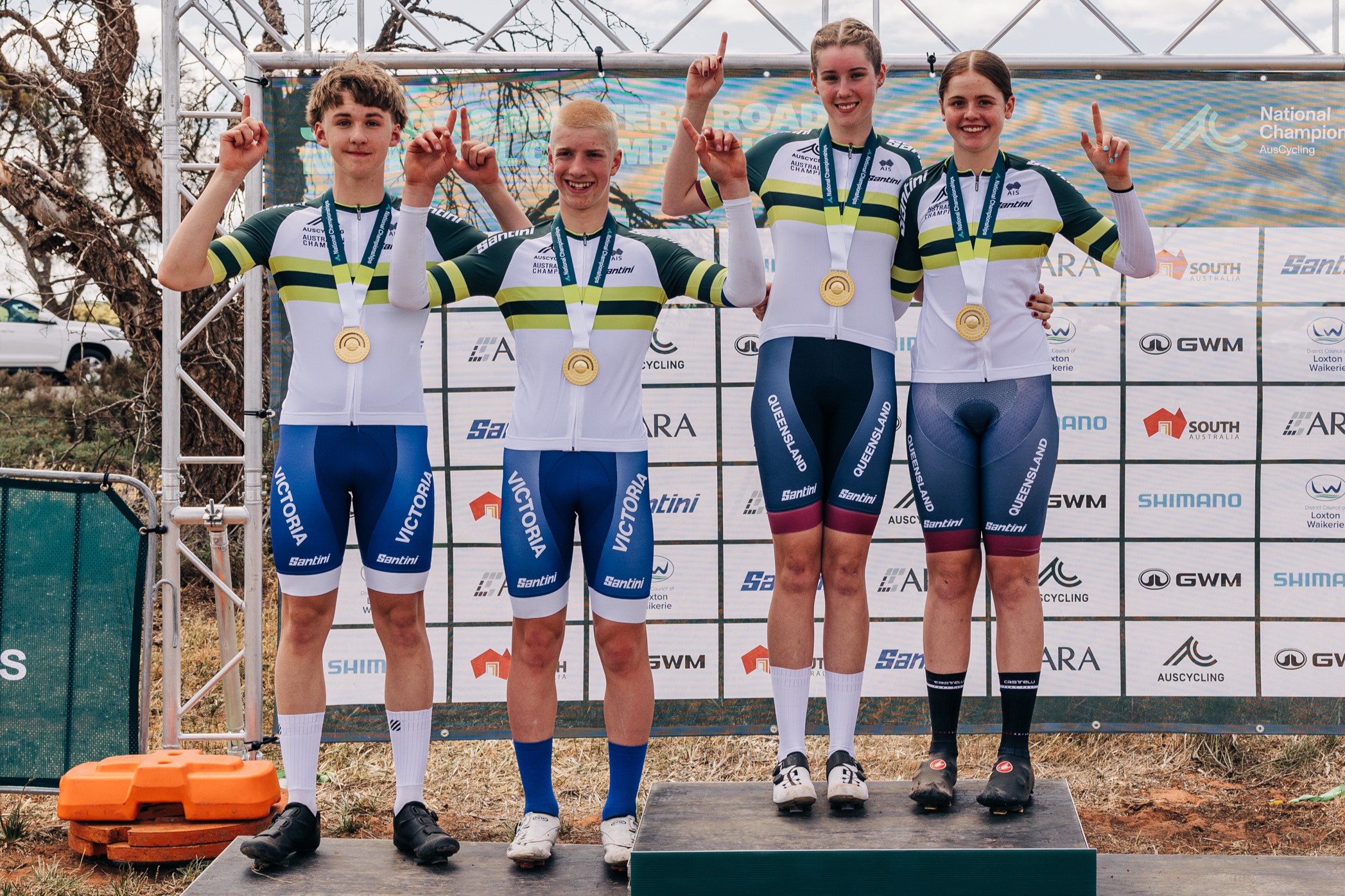 Maximus Moore, Lachlan Stewart, Megan Moore and Ava Robbins in the national champion jerseys after winning their individual time trials at the 2024 AusCycling Masters and Junior Road National Championships in Loxton