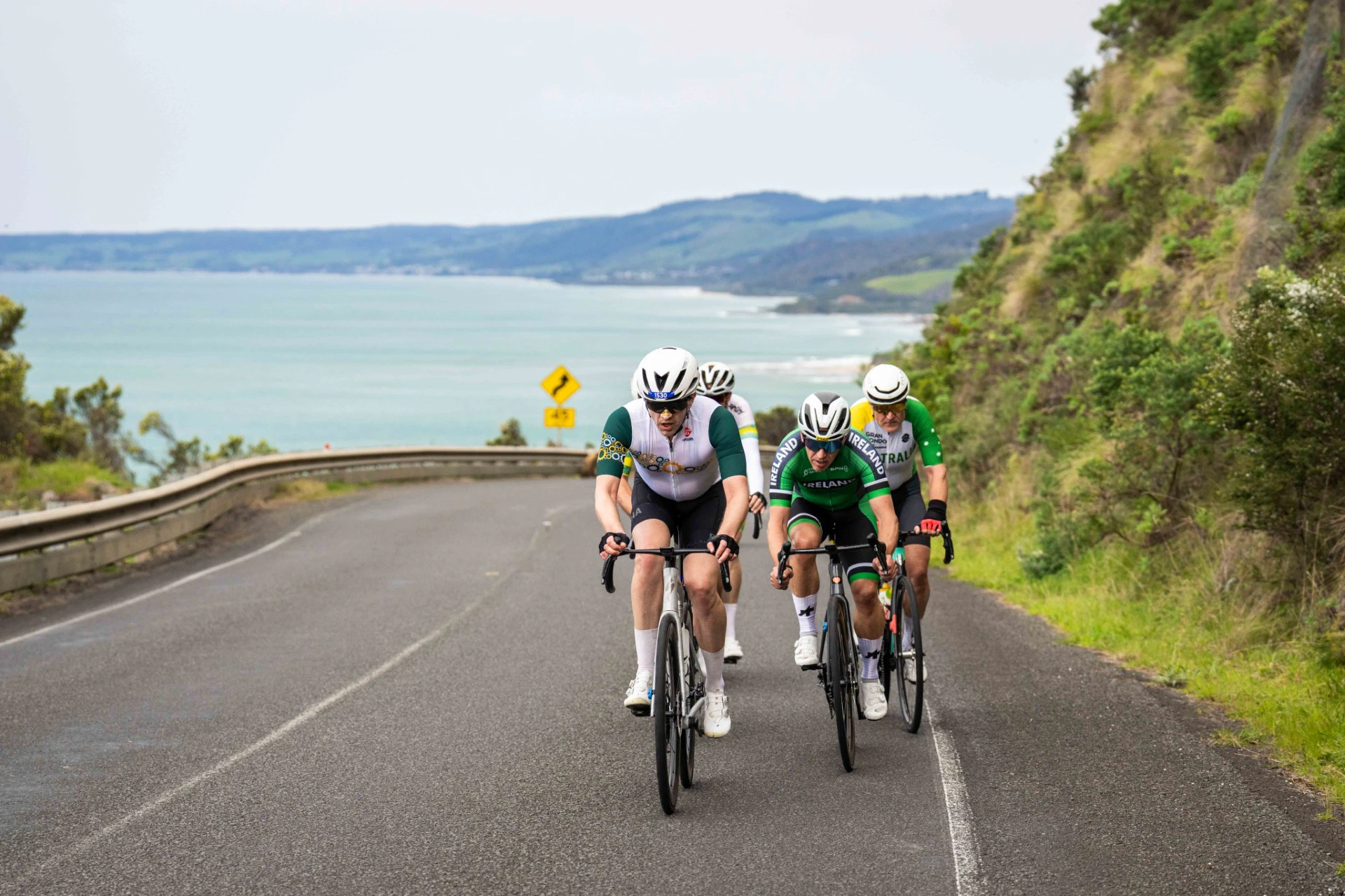 A small group of Australian and Irish cyclists during the UCI Gran Fondo World Championships gran fondo road race starting and finishing in Lorne and taking place on the Great Ocean Road, Victoria, Australia alongside Amy's Gran Fondo.