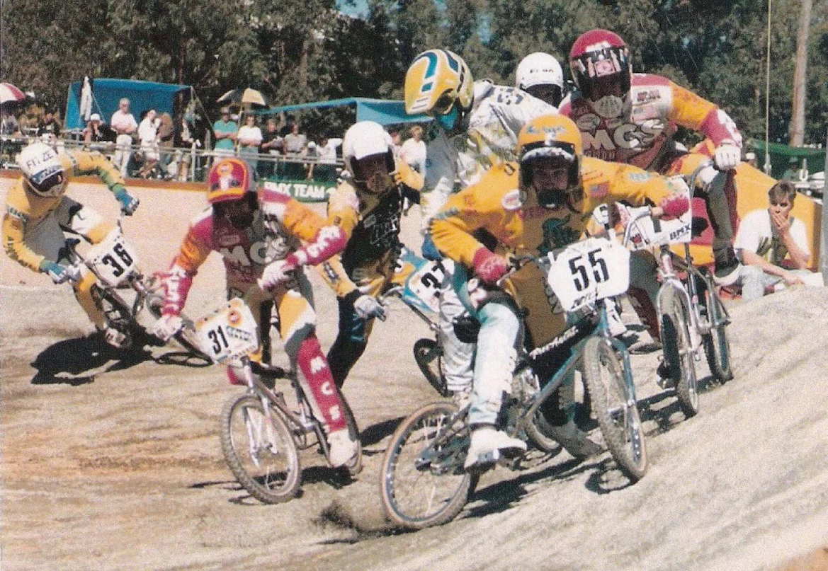 BMX Racing riders skid through a corner at the 1989 IBMXF World Championships in Chandler Velodrome, Brisbane (Photo: Darrell Mr Click Lockhart)