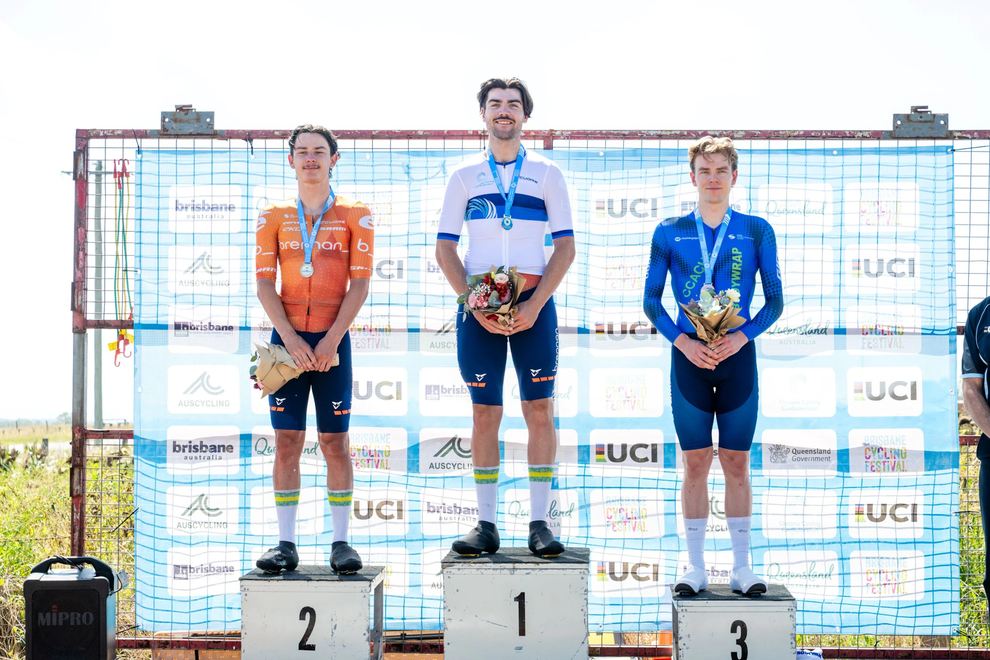 Conor Leahy, Oliver Bleddy and Alistair Christie-Johnston on the podium of the elite men individual time trial Oceania Road Championships 2026 in Brisbane. Media Queensland