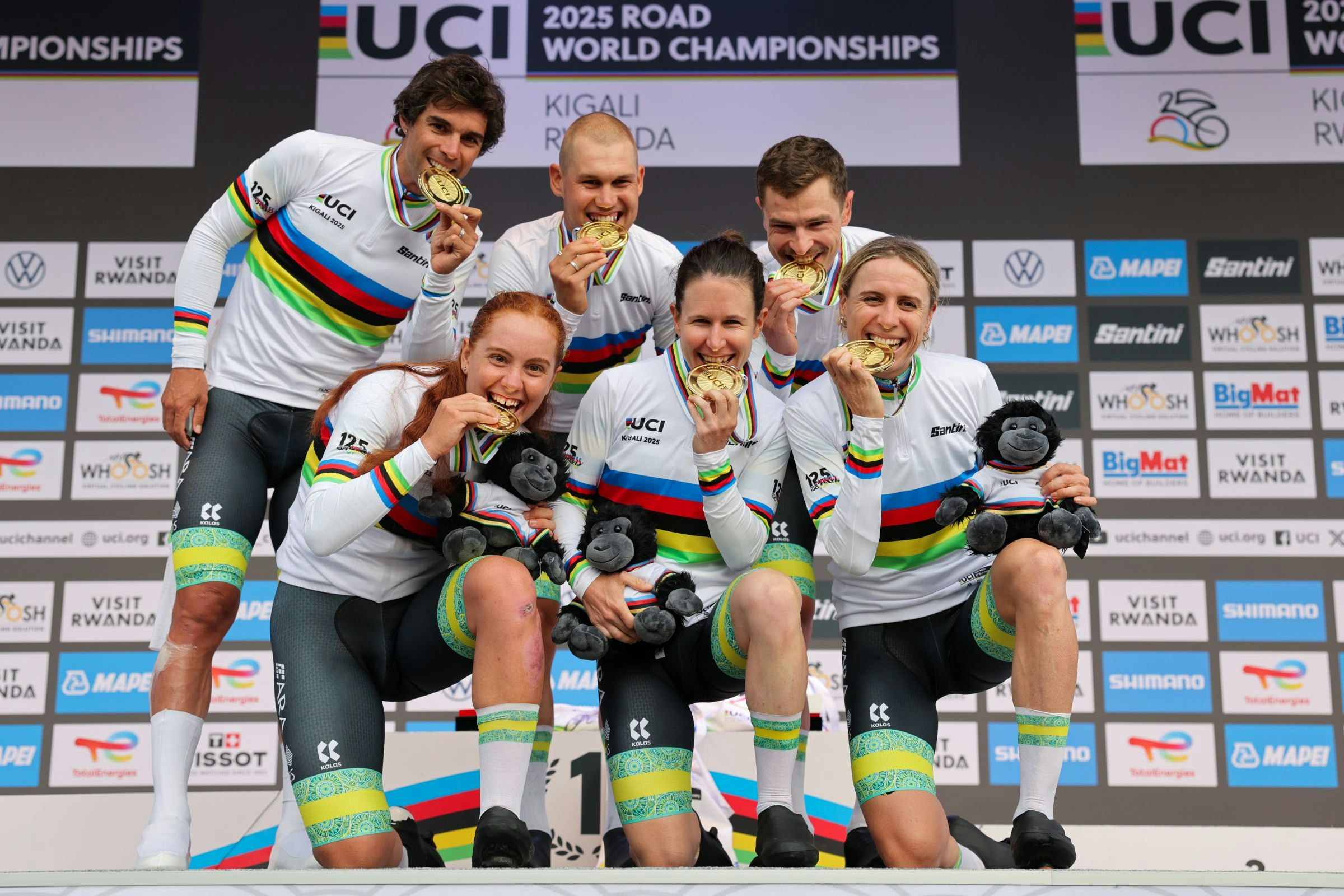 2025 UCI Road World Championships - Kigali Convention Centre, Kigali, Rwanda - Team Time Trial Mixed Relay Podium - Felicity Wilson-Haffenden, Amanda Spratt, Brodie Chapman, Jay Vine, Lucas Plapp, Michael Matthews (Australia) receiving the Gold Medal to become World Champion