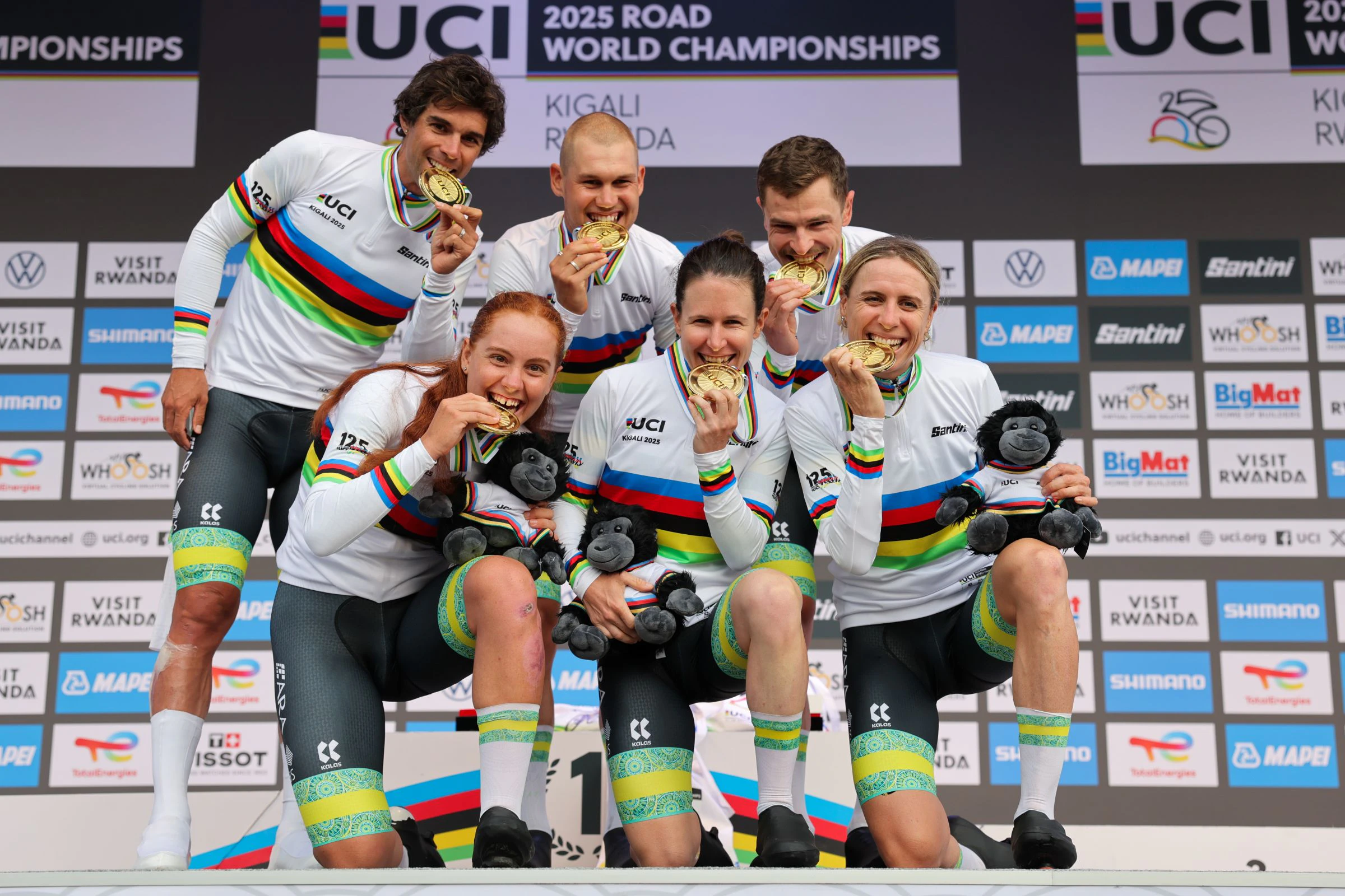 2025 UCI Road World Championships - Kigali Convention Centre, Kigali, Rwanda - Team Time Trial Mixed Relay Podium - Felicity Wilson-Haffenden, Amanda Spratt, Brodie Chapman, Jay Vine, Lucas Plapp, Michael Matthews (Australia) receiving the Gold Medal to become World Champion