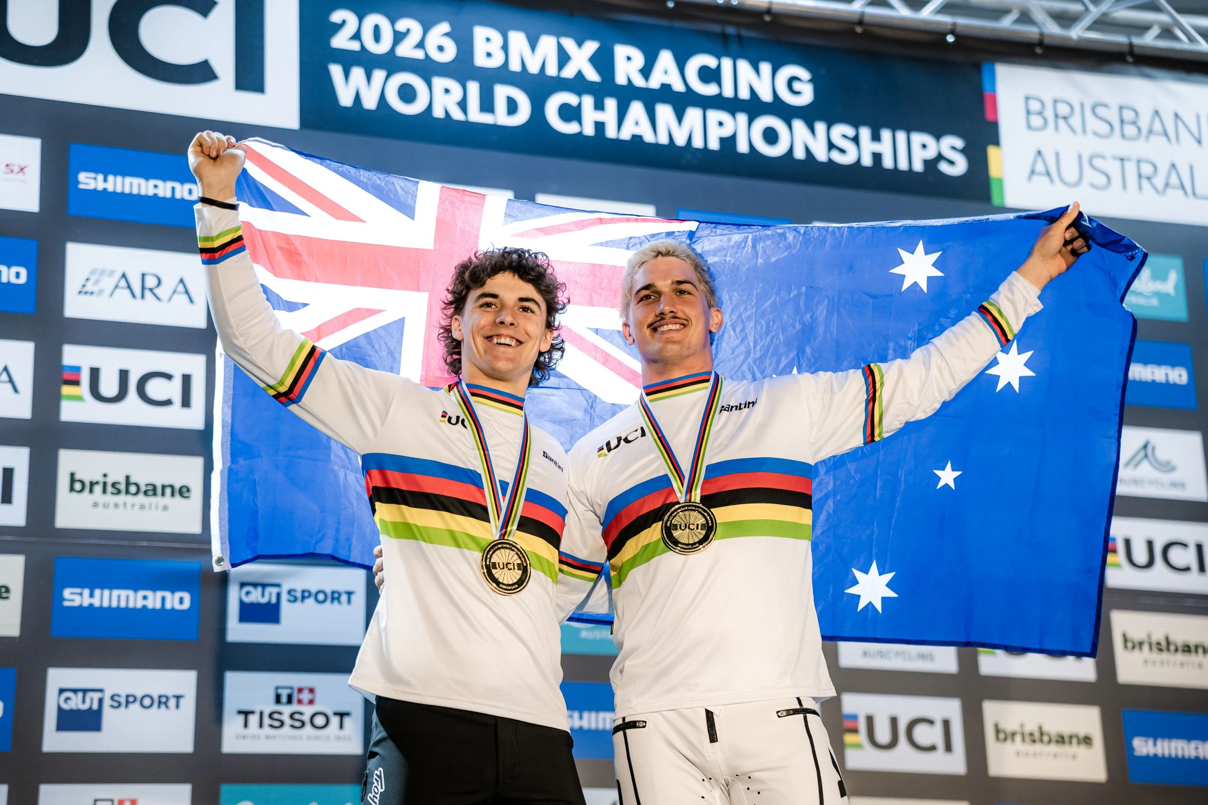 Joshua Jolly and Jesse Asmus with the Australian flag as rainbow jersey wearers and UCI World Champions at the 2026 UCI BMX Racing World Championships in Brisbane