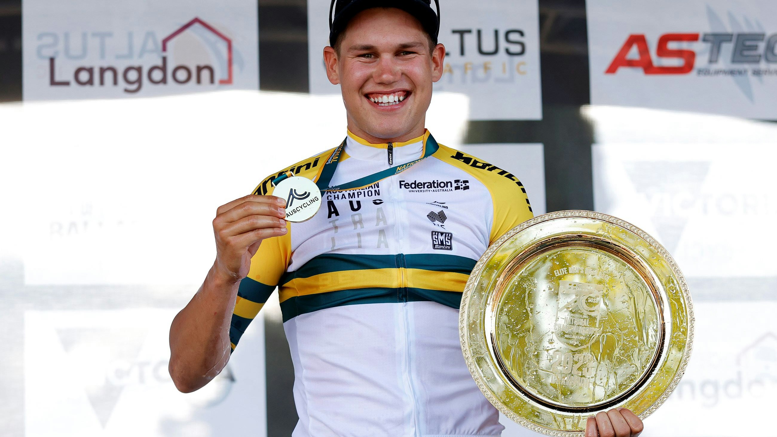 Lucas Plapp poses with medal, gold plate and green-and-gold jersey as the 2023 elite men's road race national champion at the Road National Championships RoadNats Ballarat