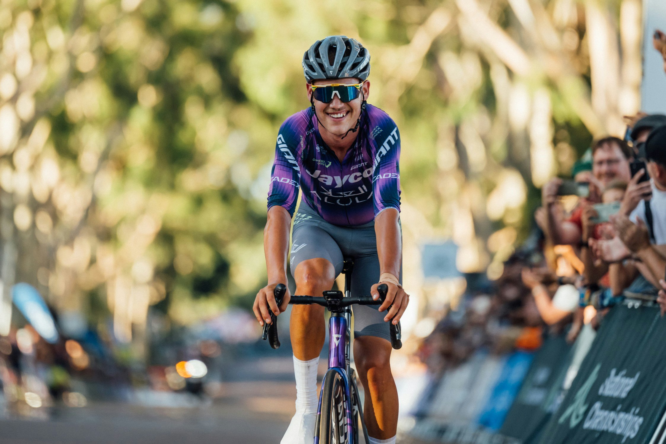 Australian cyclist Luke Plapp smiles at the finish line of the 2025 AusCycling Road National Championships