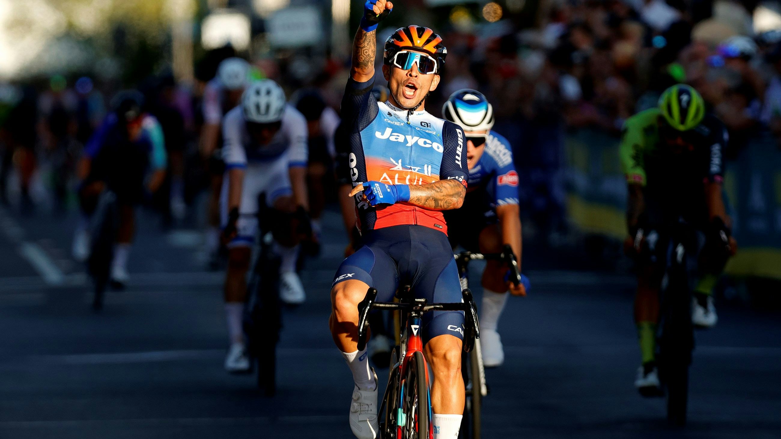 Caleb Ewan salutes in victory in the elite men criterium national championship in 2024 in Ballarat