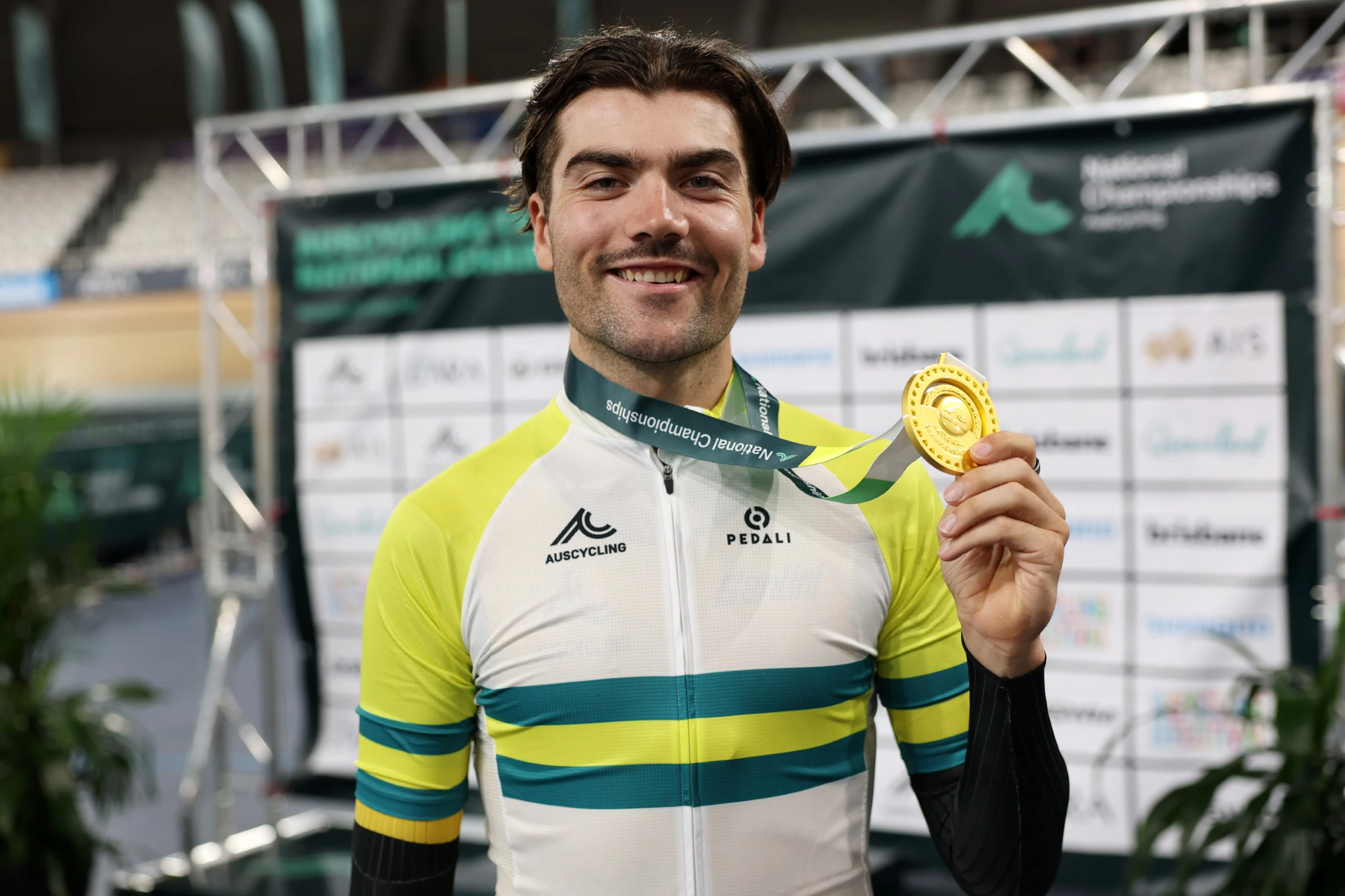 West Australian cyclist Conor Leahy celebrates with gold medal and champion's jersey winning the men's individual pursuit with a national record at the 2026 AusCycling Track National Championships at the Anna Meares Velodrome, Brisbane, Queensland