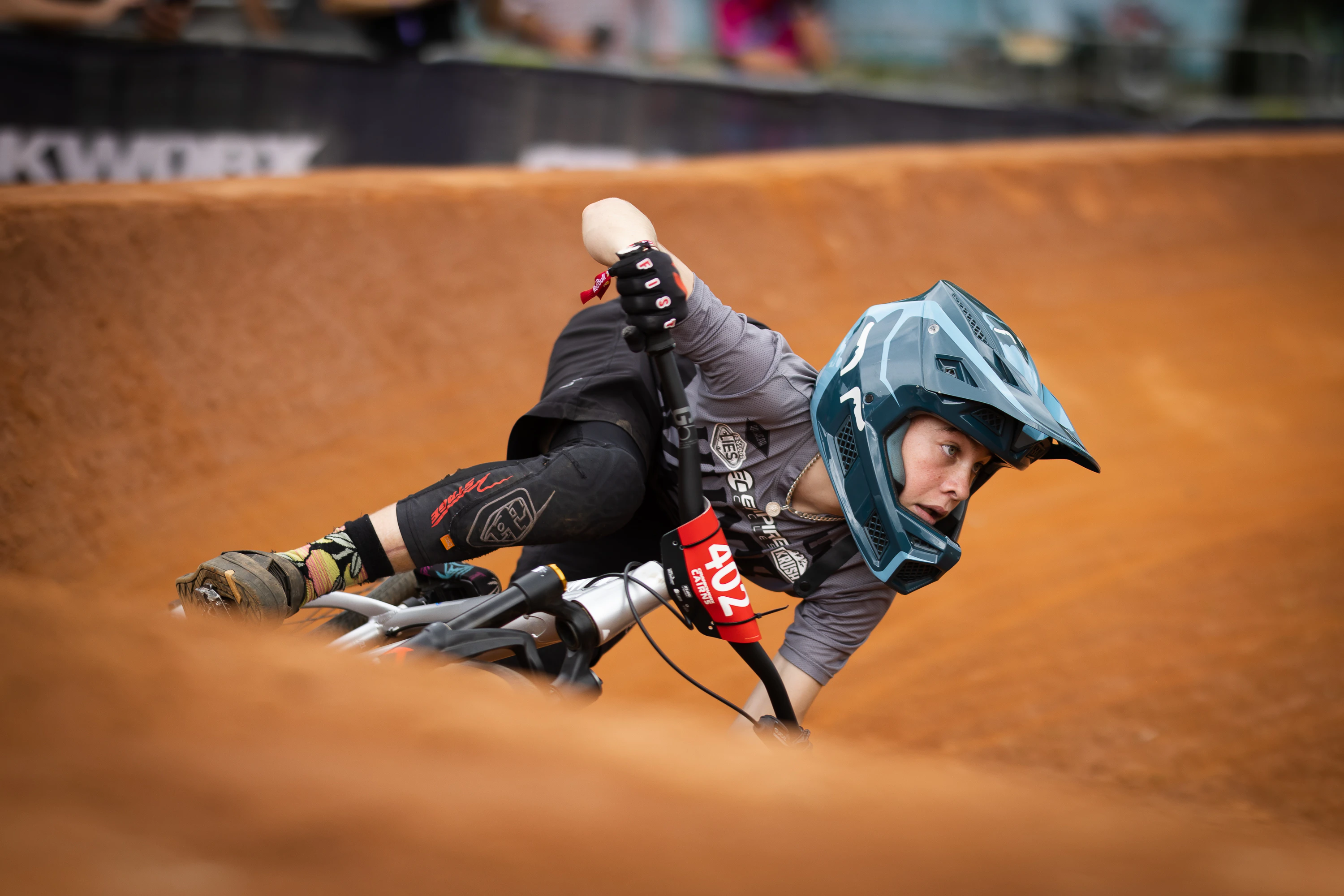 West Australian junior mountain biker and cyclist Cooper Dunlop racing around a dirt berm at Crankworx Cairns in 2023