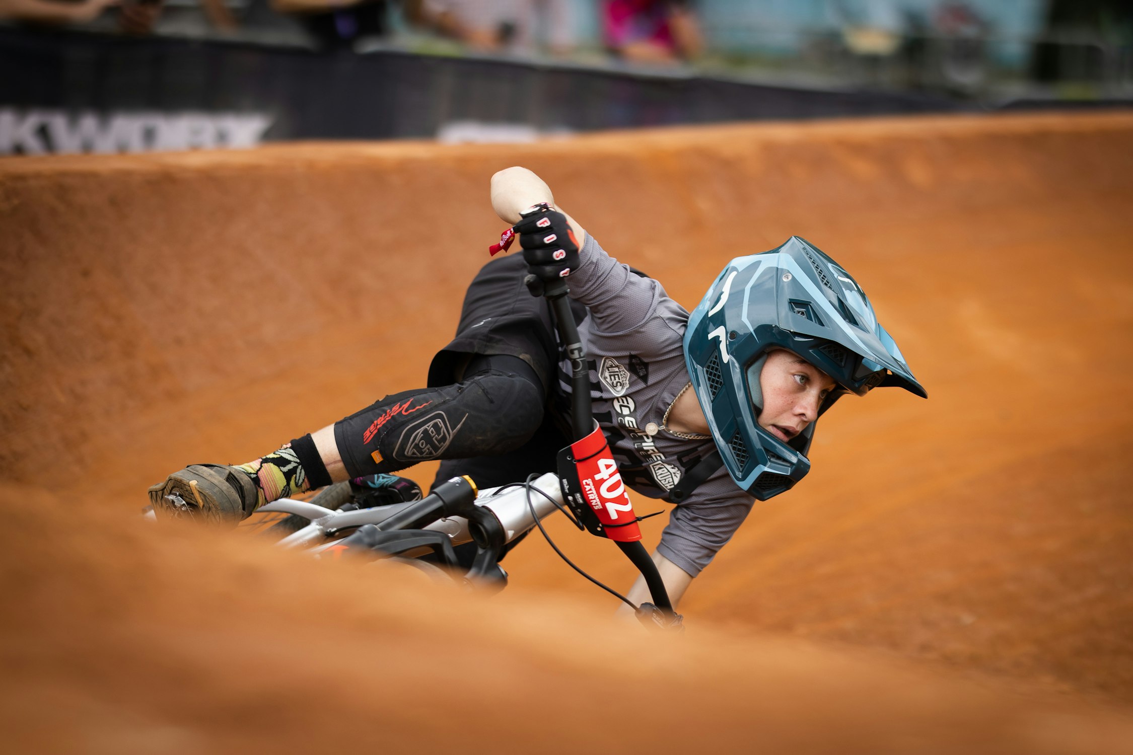 West Australian junior mountain biker and cyclist Cooper Dunlop racing around a dirt berm at Crankworx Cairns in 2023