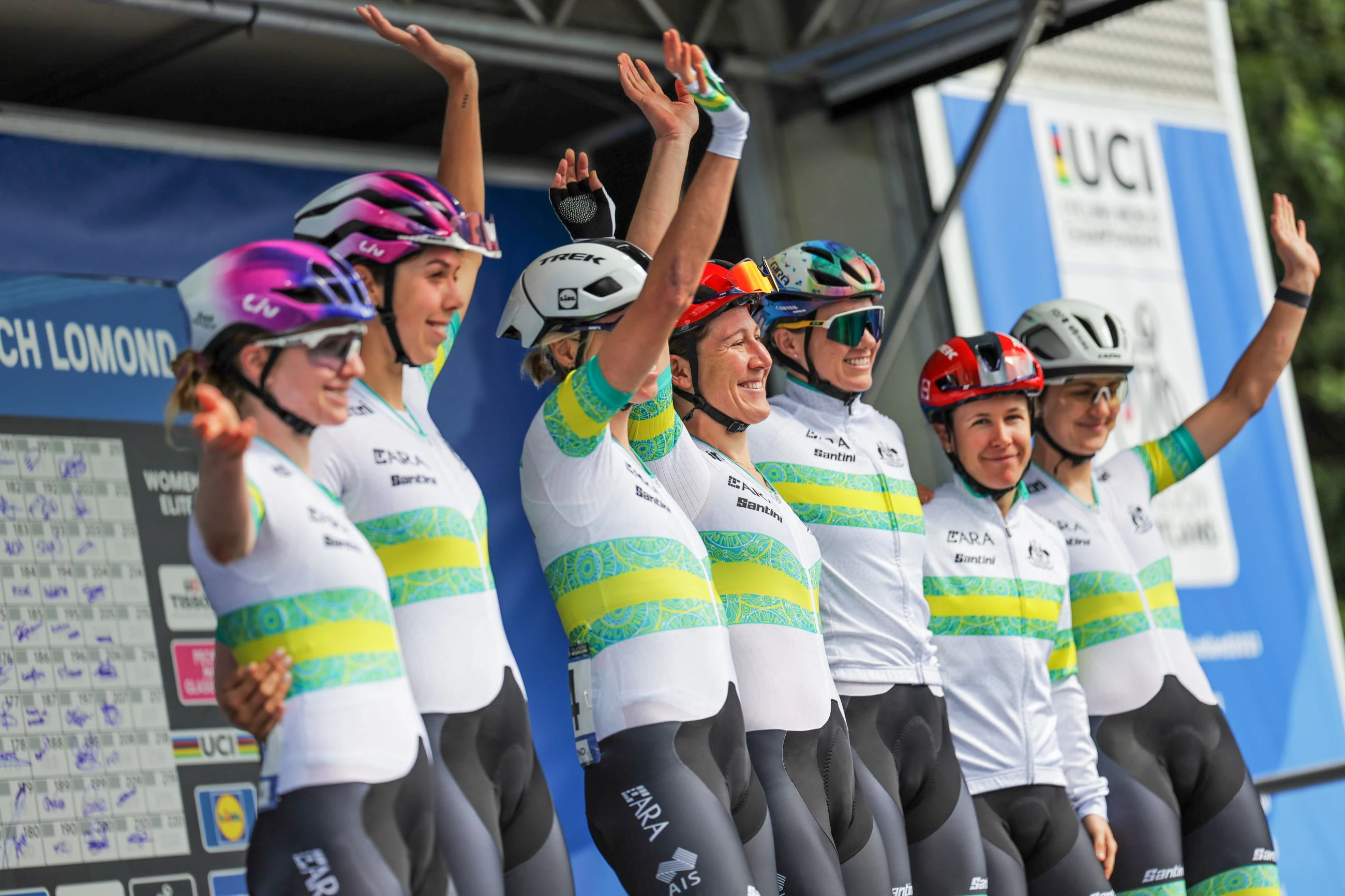 The ARA Australian Cycling Team elite women's road race riders waving at team presentation at the Glasgow 2023 UCI Road World Championships