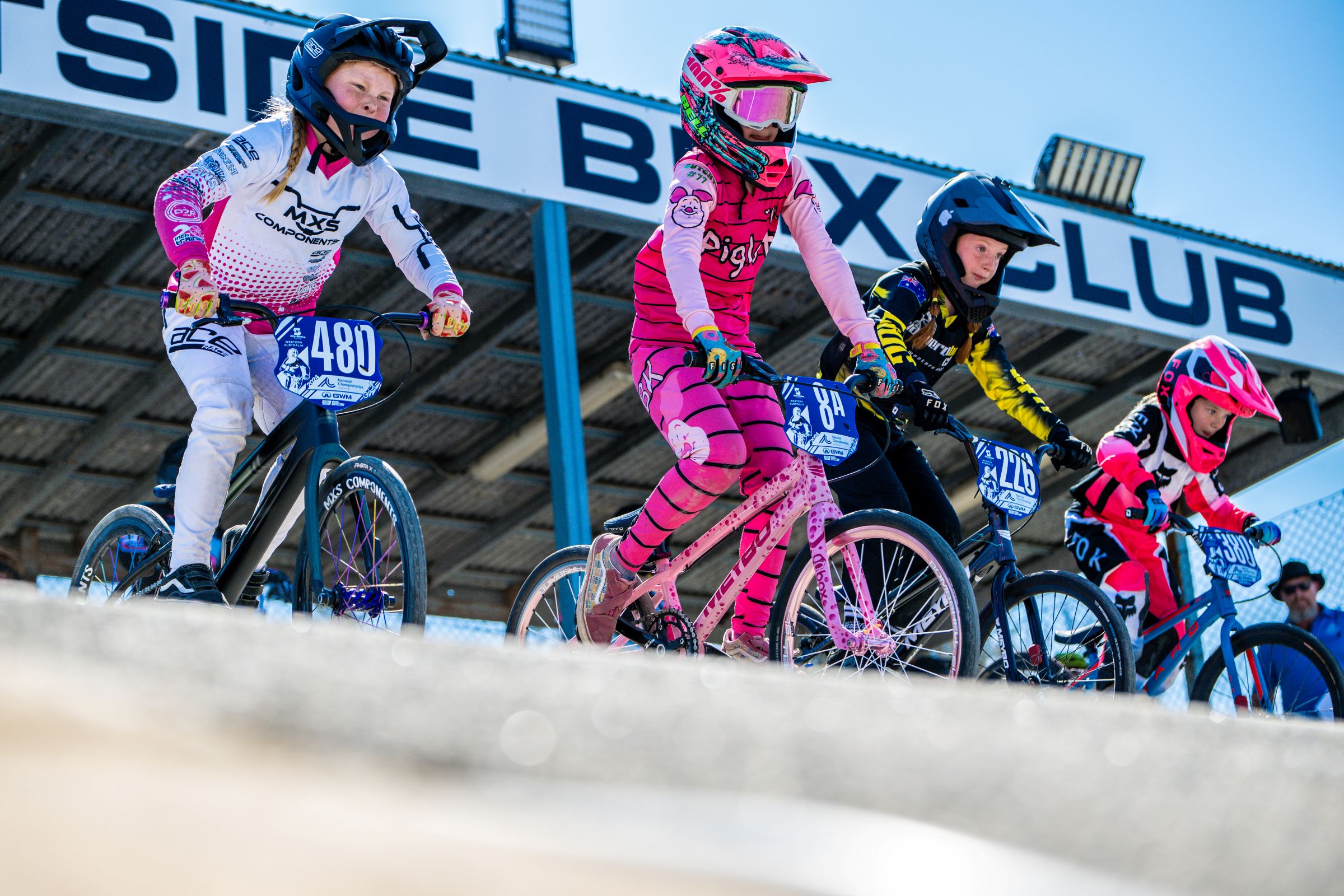 Young girls line up in a BMX Racing event at Westside BMX Club at an AusCycling National Championships