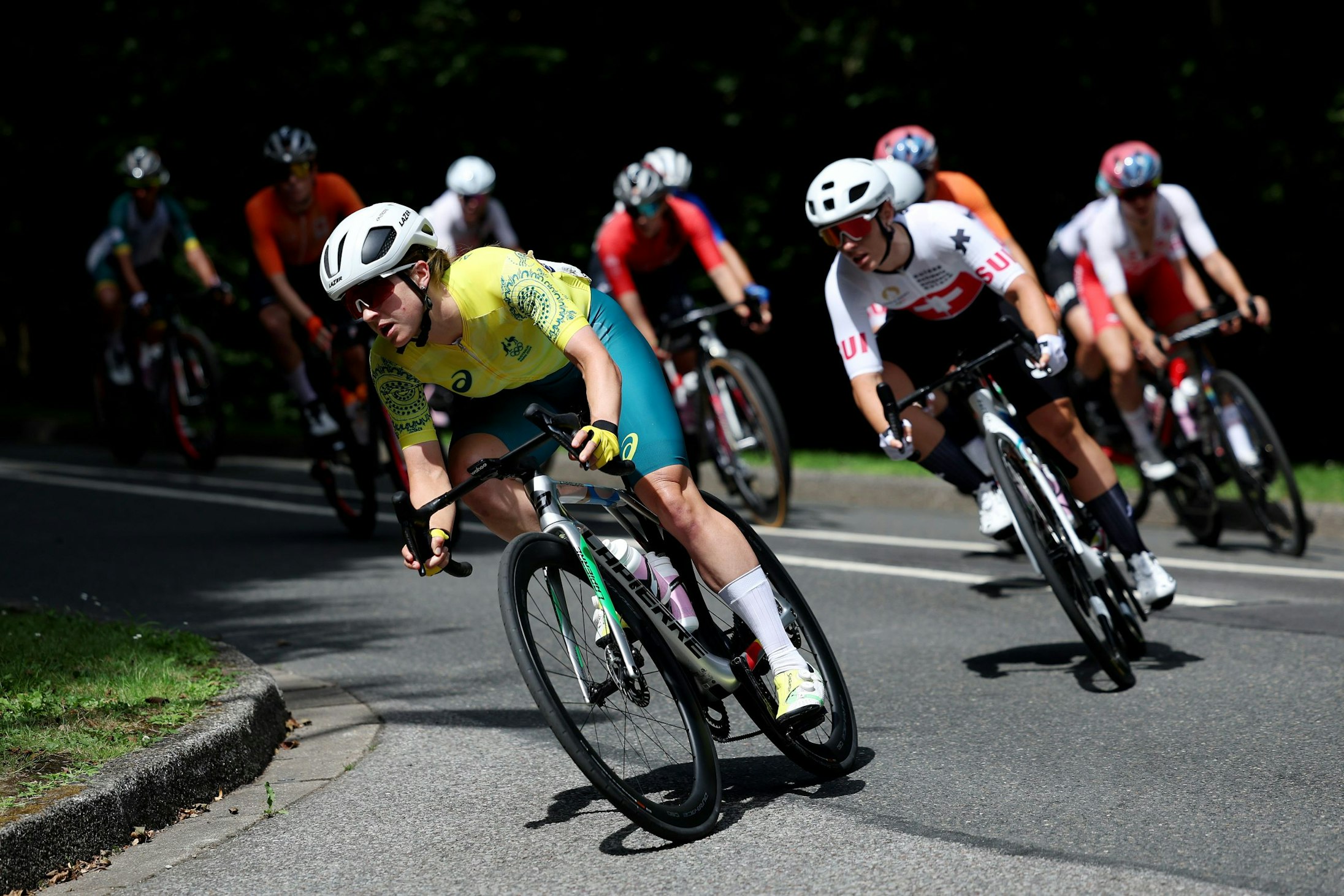 Australian cyclist Grace Brown takes a corner in the Paris 2024 Olympic women's road race