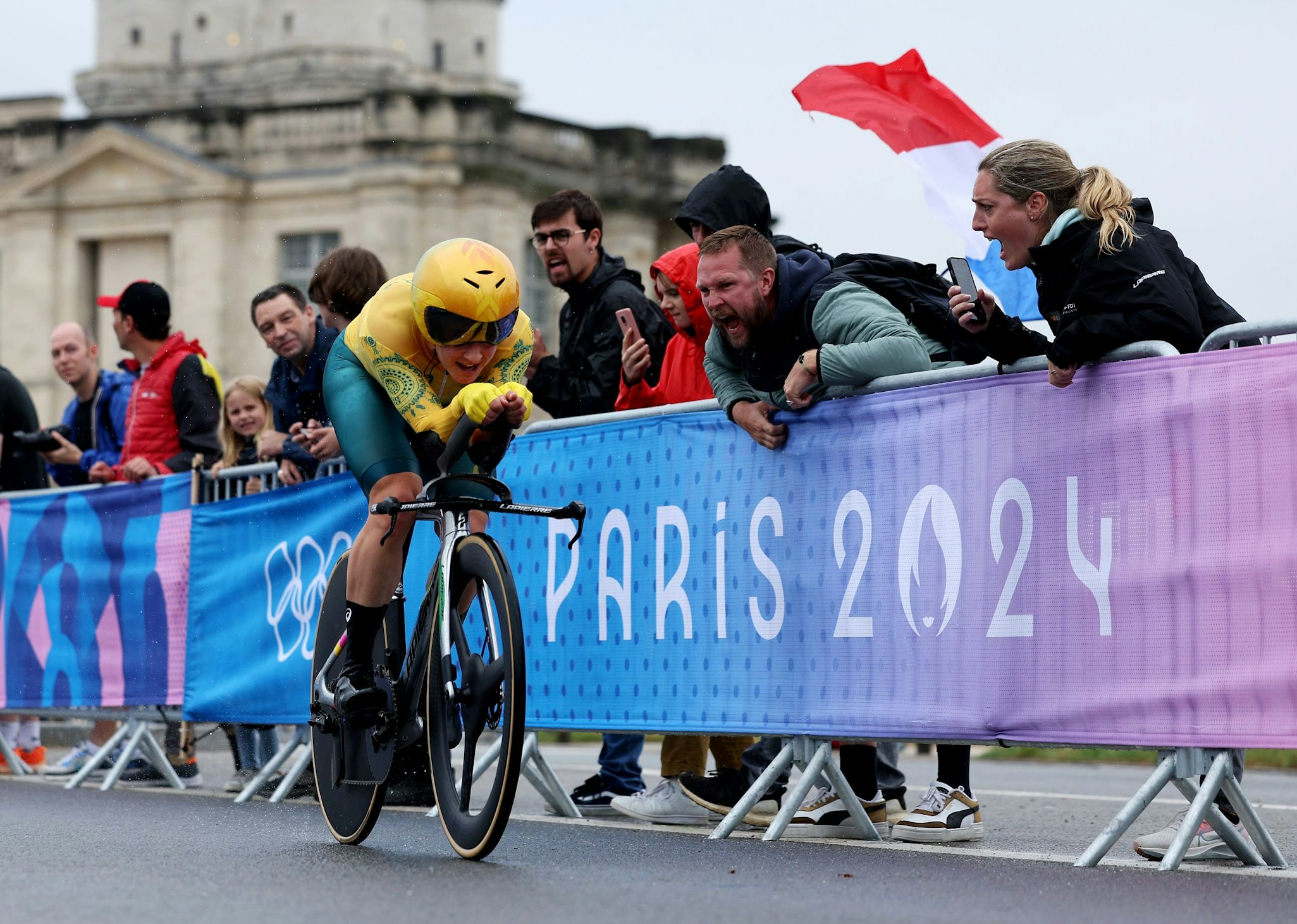 Australian cyclist Grace Brown rides past a cheering French crowd towards gold in the Paris 2024 Olympic Games individual time trial