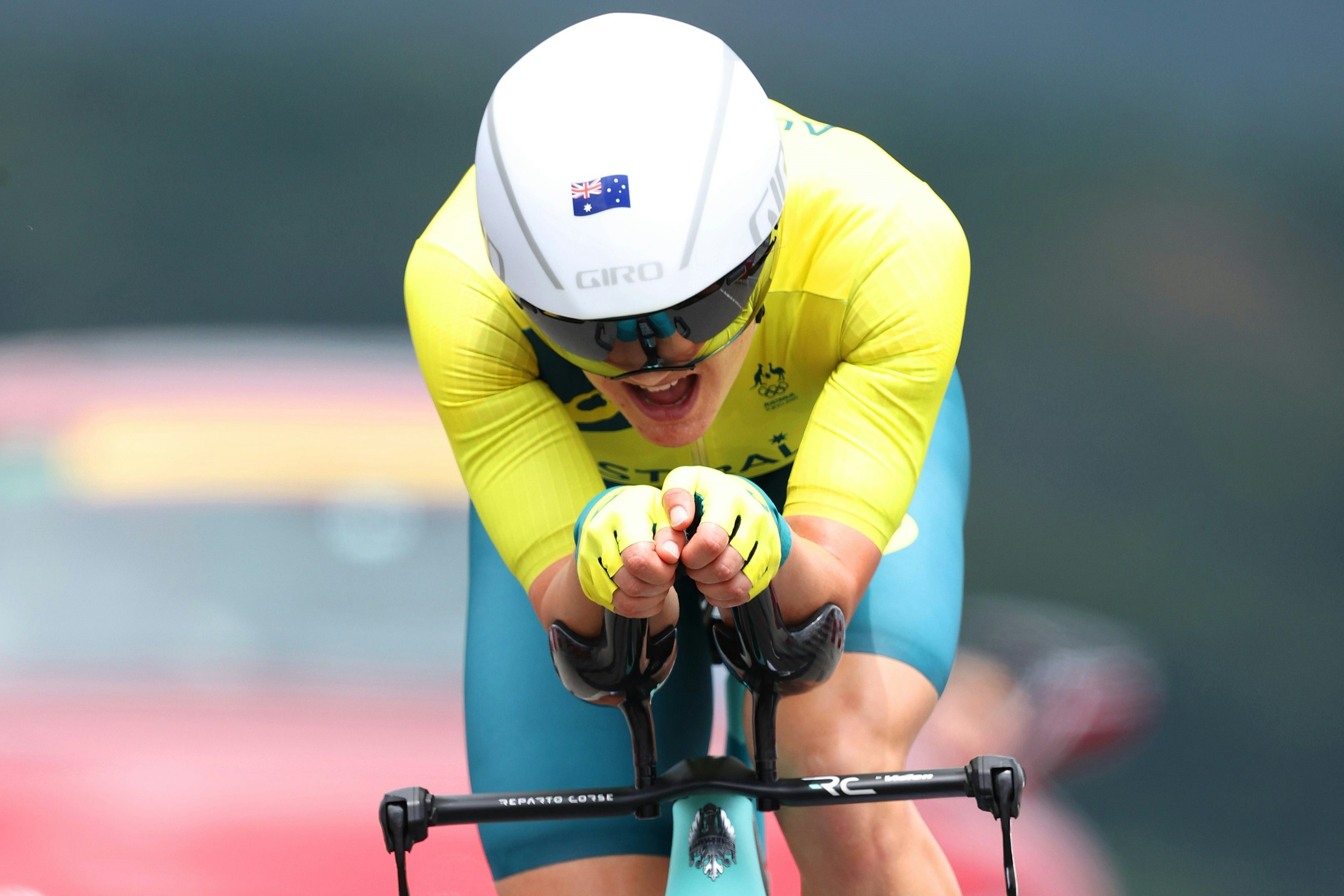 A front-on close-up of Australian cyclist Grace Brown as she races with intensity in the individual time trial at the Tokyo 2020 Olympic Games