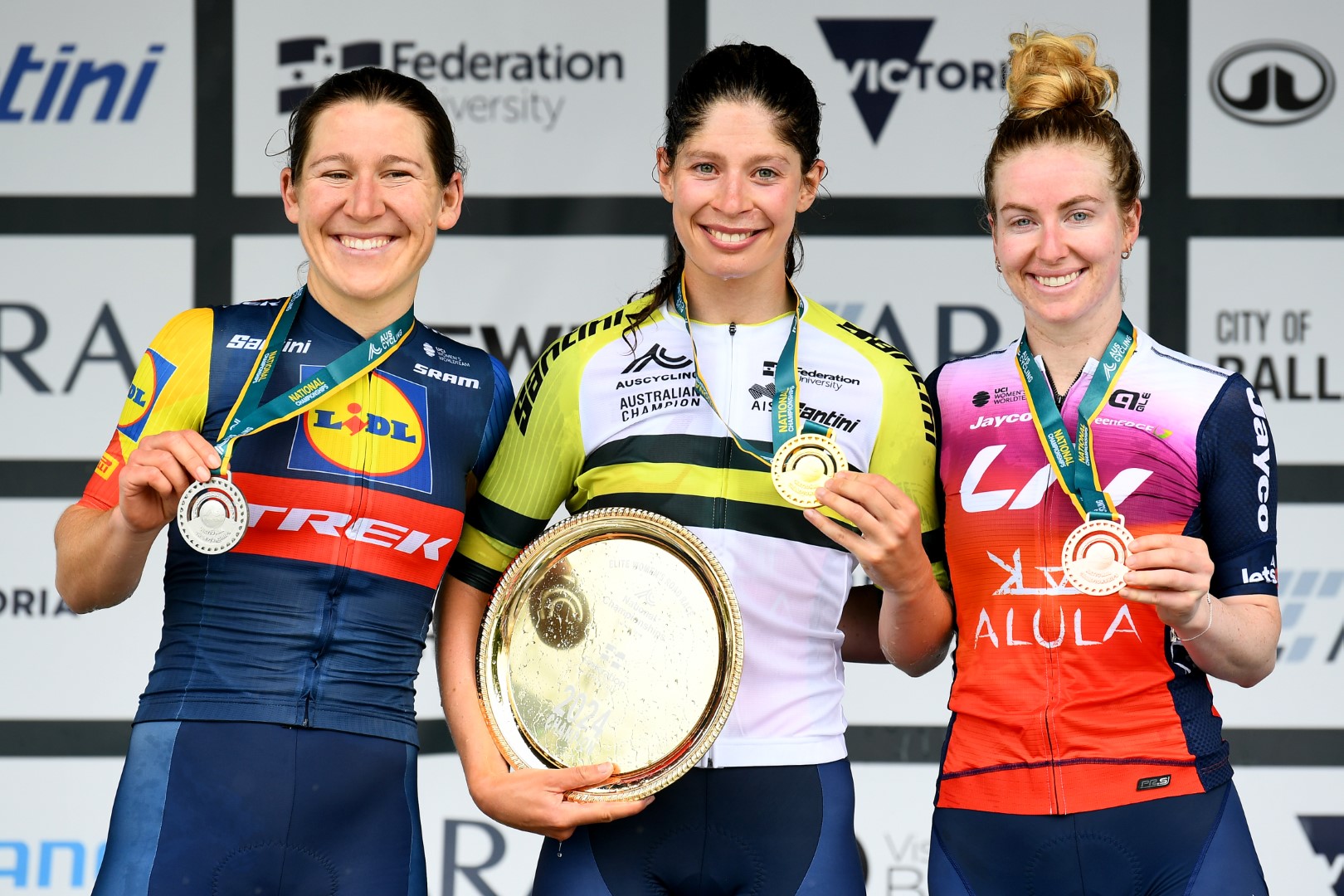 Ruby Roseman-Gannon, Lauretta Hanson and Alexandra Manly on the elite women's road race podium at the 2024 AusCycling Road Race National Championships in Buninyong, Ballarat