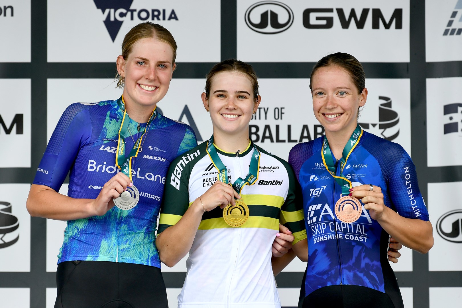 Neve Bradbury, Haylee Fuller and Ella Simpson on the under-23 women road race national championship podium in Buninyong, Ballarat in 2024