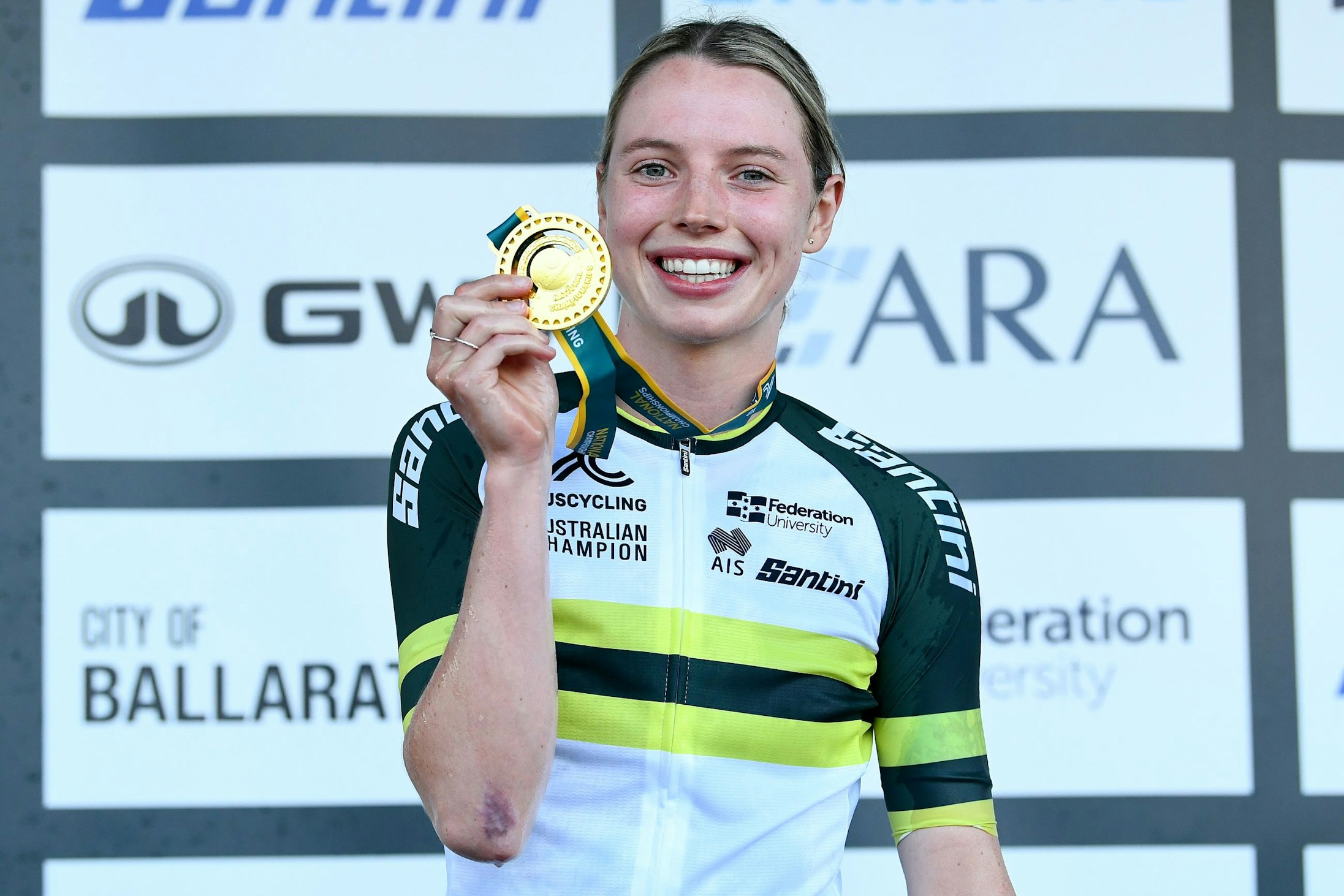 Keely Bennett poses with the gold medal of 2024 U23 women's criterium national champion in Ballarat