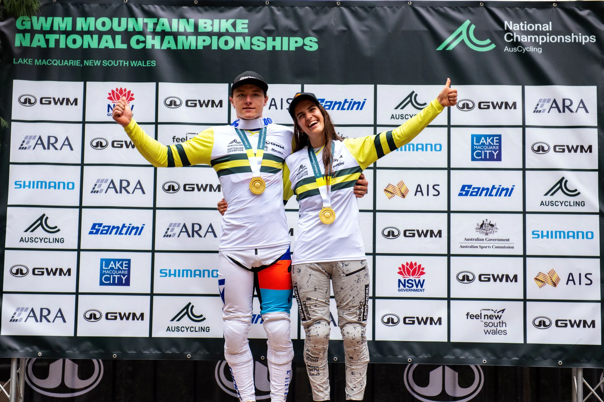 Australian downhill mountain bikers Luke Meier-Smith and Ellie Smith pose with their medals and jerseys as winners of the 2024 national championships.jpg