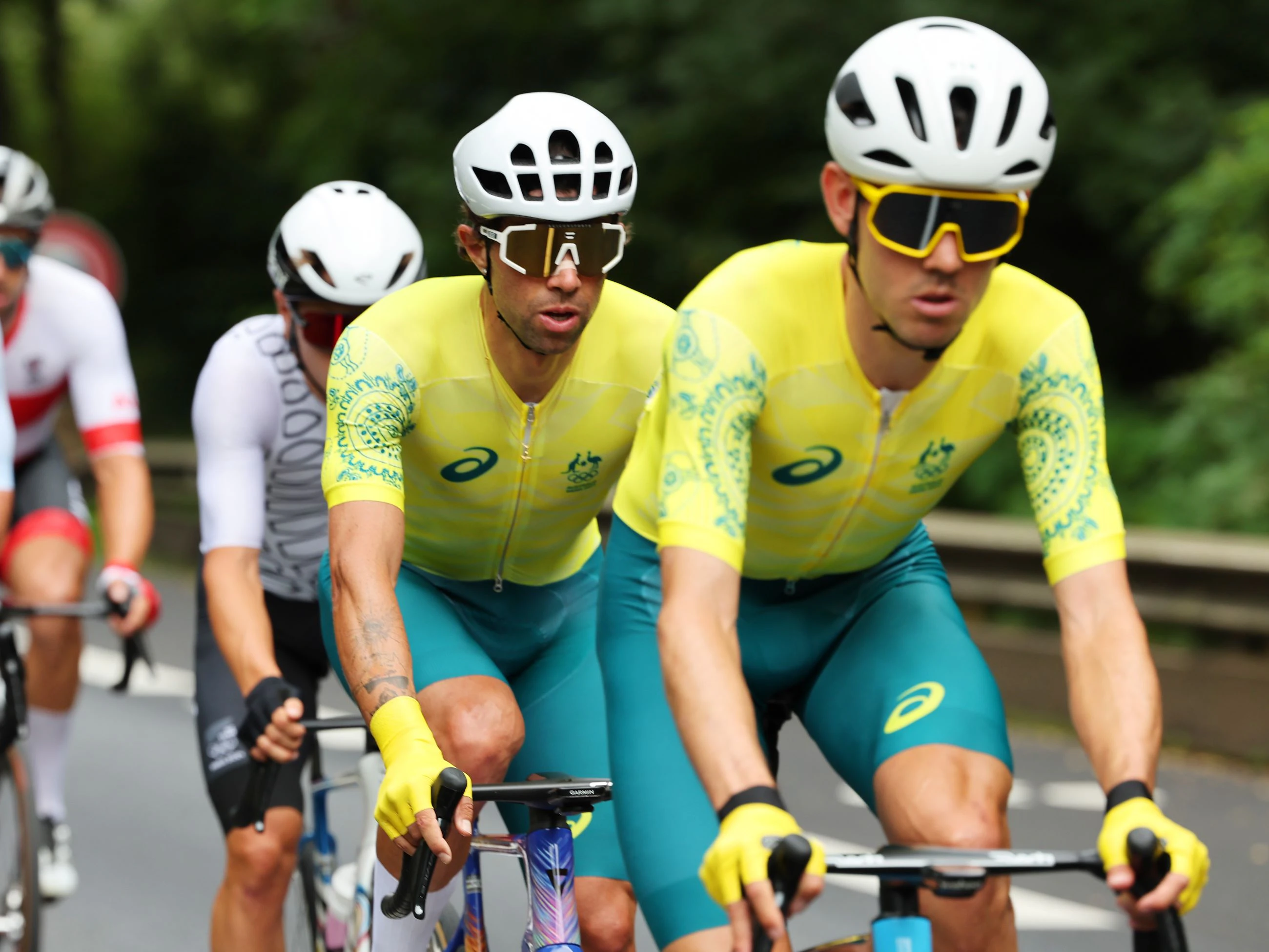 Australian cyclists Michael Matthews and Ben O'Connor riding during the Paris 2024 Olympic Games men's road race