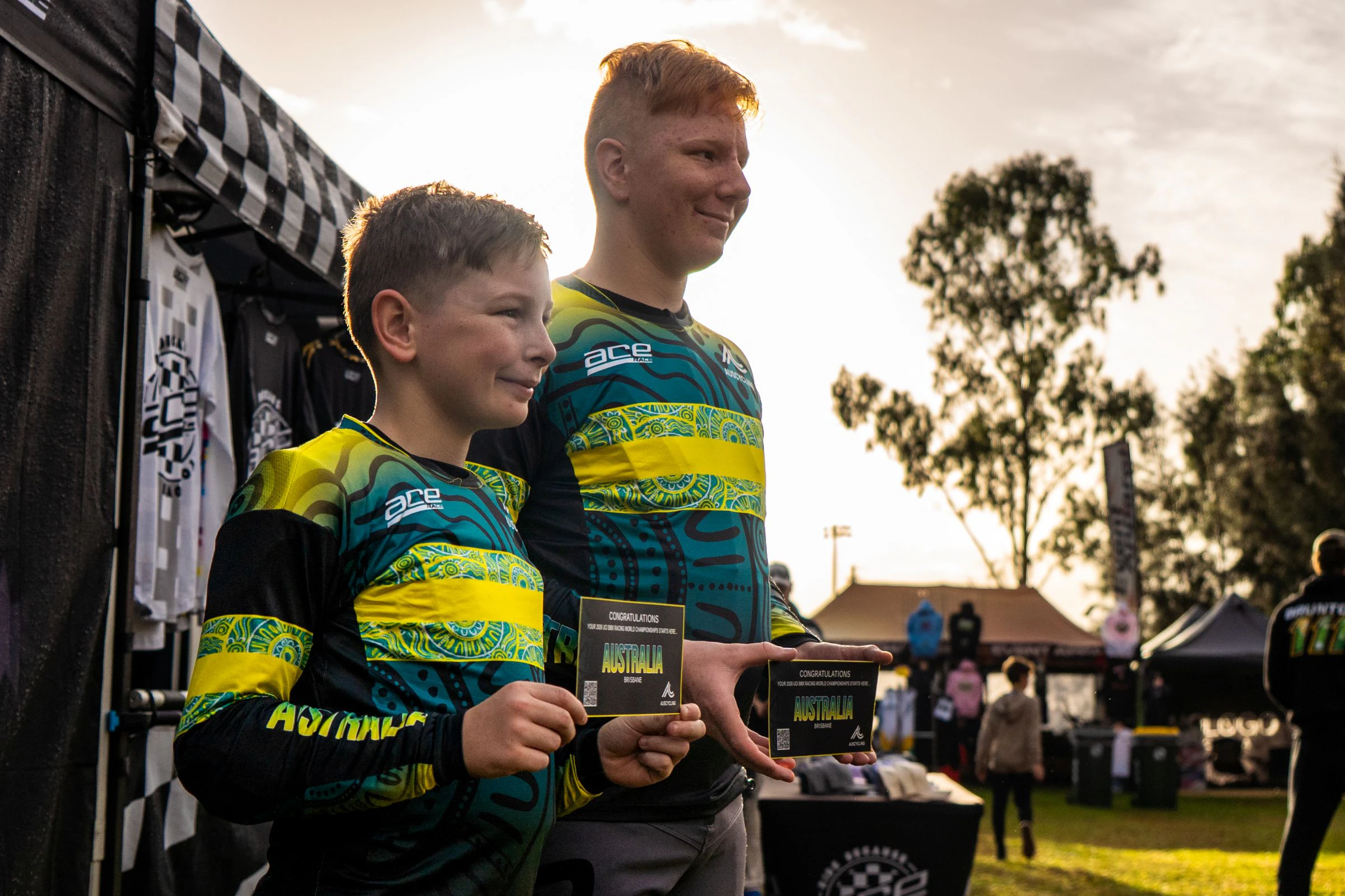 Two brothers hold their Team Australia qualifying tickets and pose after qualifying for the UCI BMX Racing World Championship Challenge at Macarthur