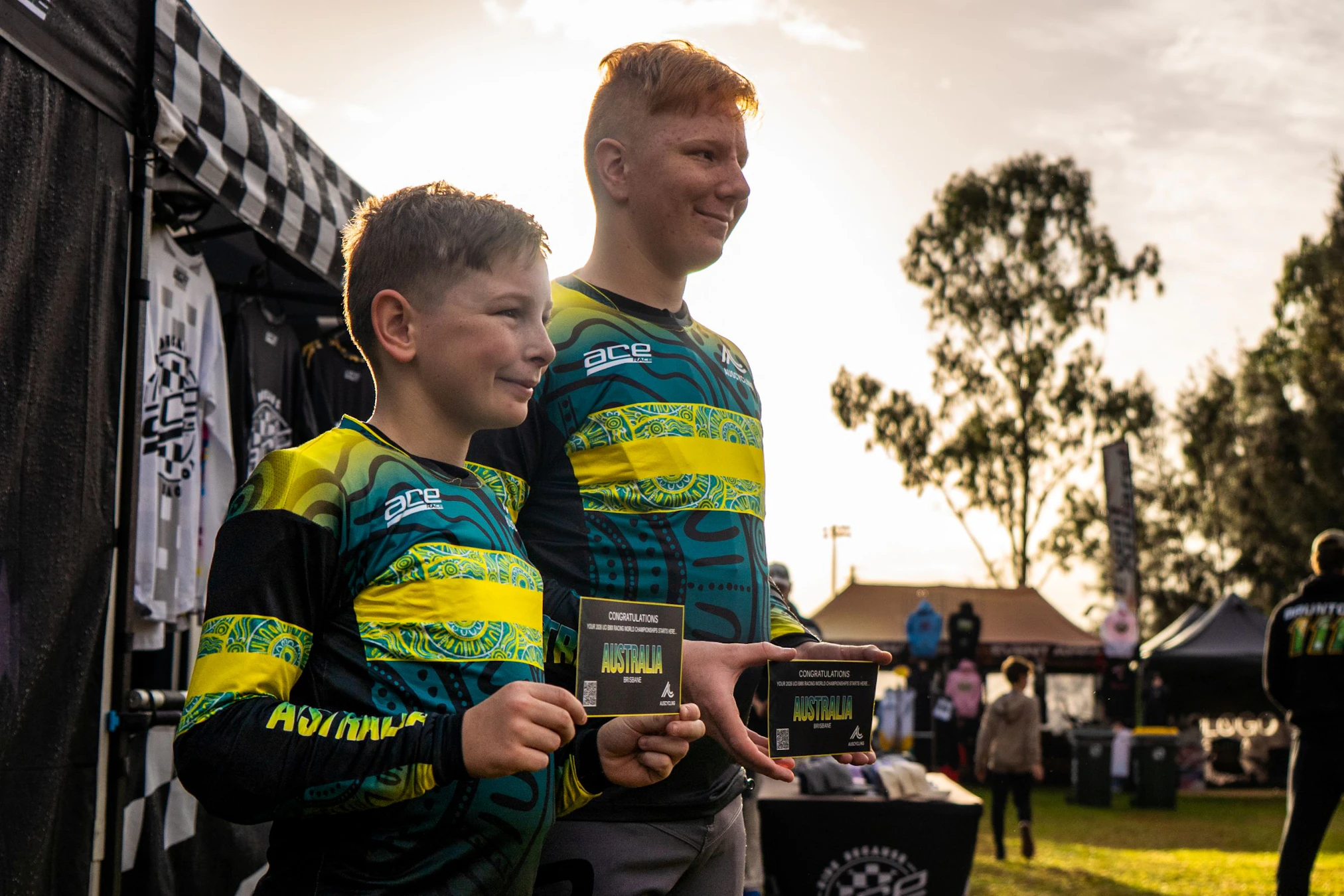 Two brothers hold their Team Australia qualifying tickets and pose after qualifying for the UCI BMX Racing World Championship Challenge at Macarthur
