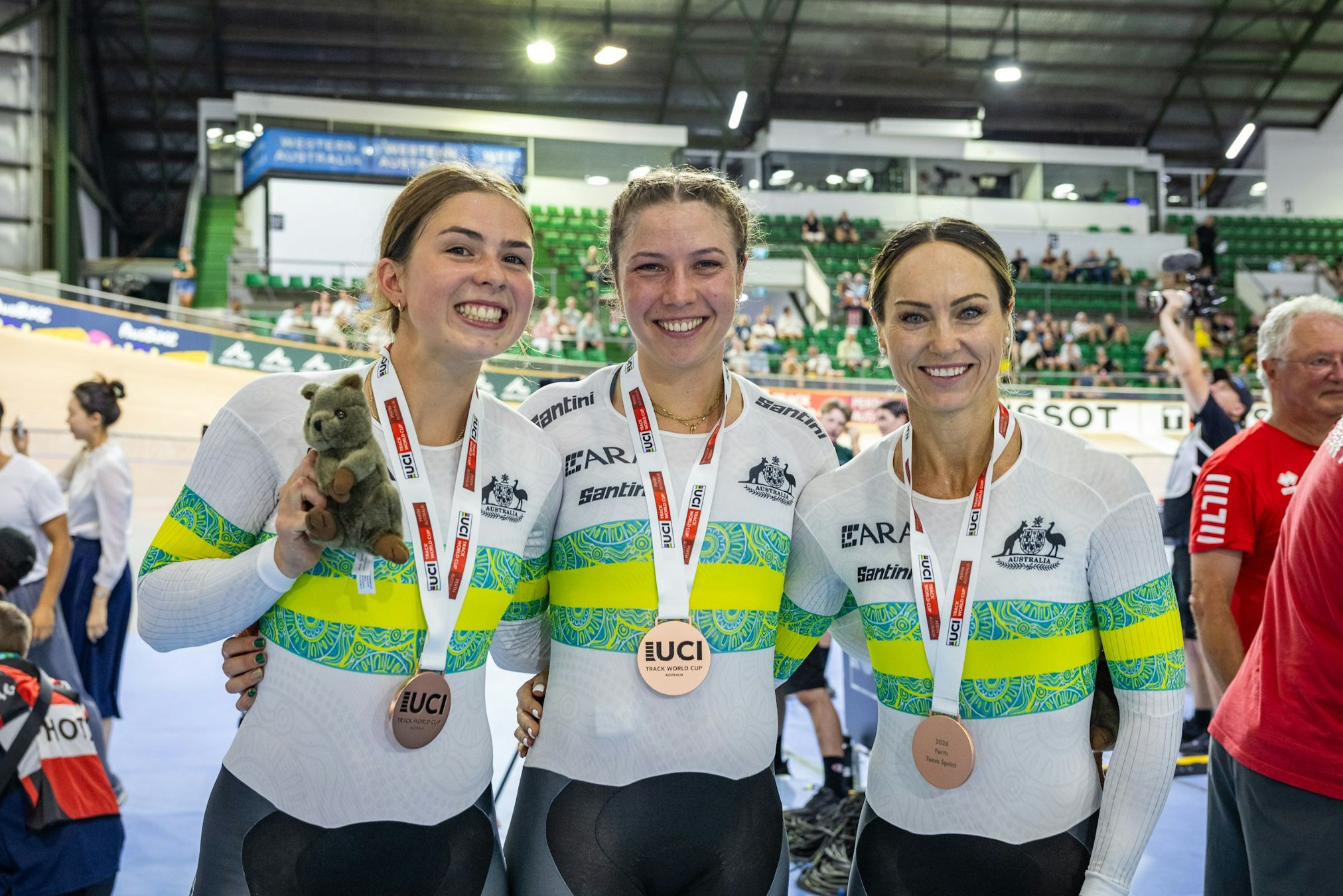 Liliya Tatarinoff, Sophie Watts and Kristine Perkins with bronze medals and quokkas in the Women Team Sprint at the 2026 UCI Track World Cup in Perth, Western Australia