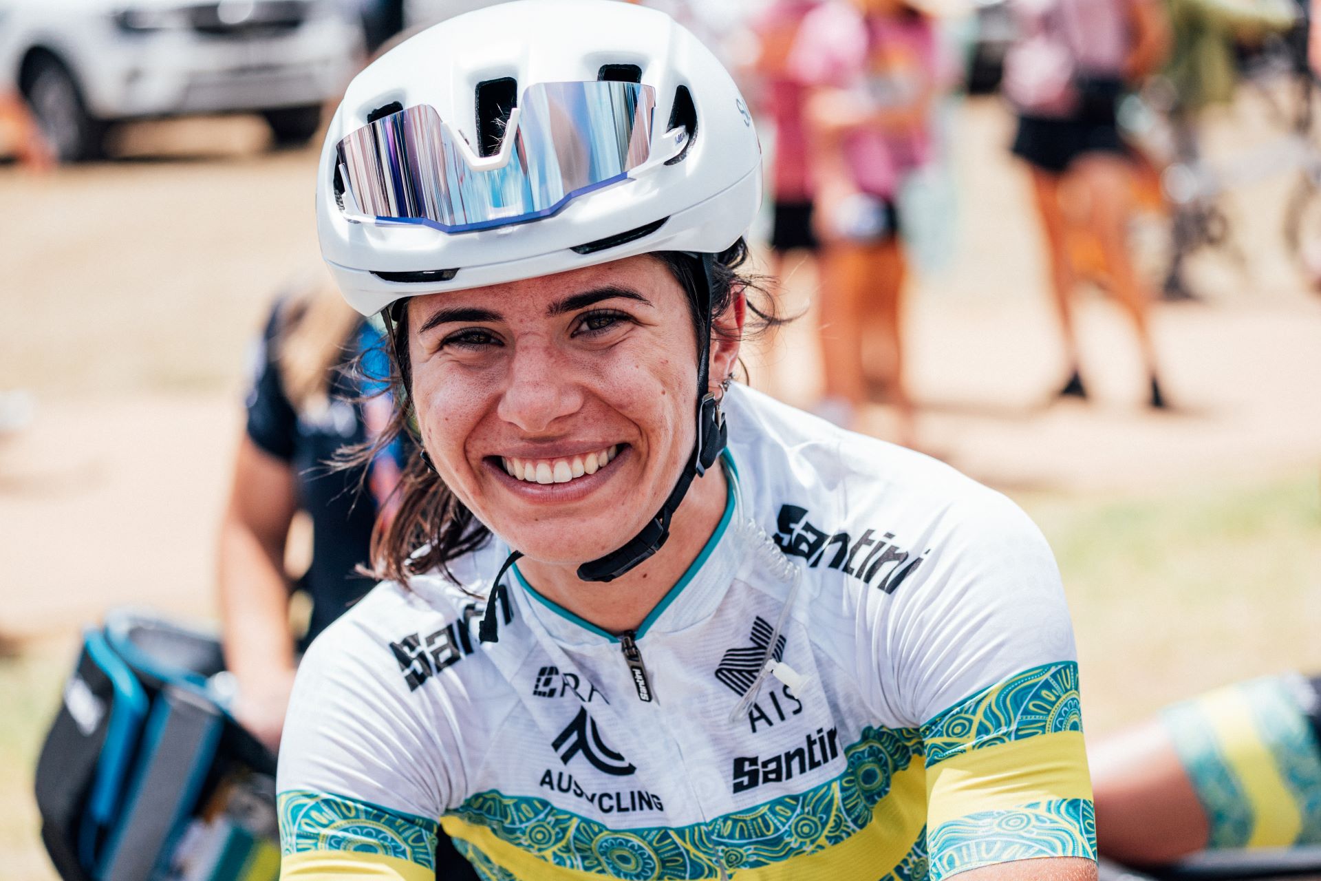 Alyssa Polites smiles before the 2025 Santos Tour Down Under where she would represent the ARA Australian Cycling Team