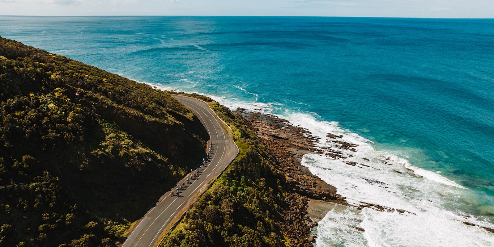 Aerial photo of cyclists riding on the Great Ocean Road