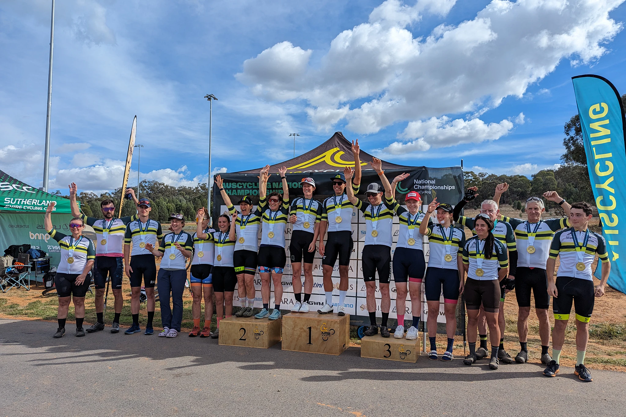 AusCycling road cyclists standing across podium