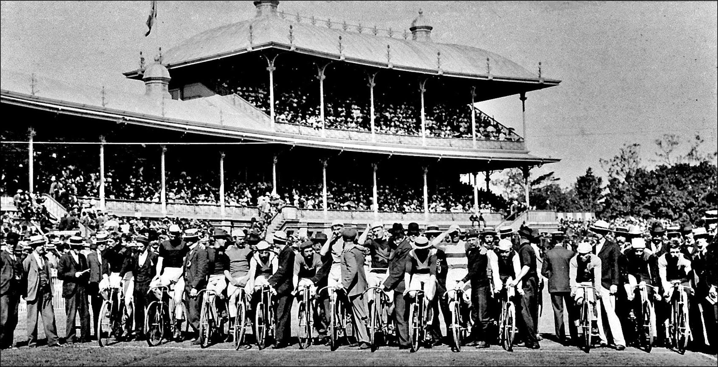 In the regular tradition, Austral race finalists lined up in front of the grandstand for a group photo before the race start. The winner here in 1899 would be Percy Beauchamp, second from left.