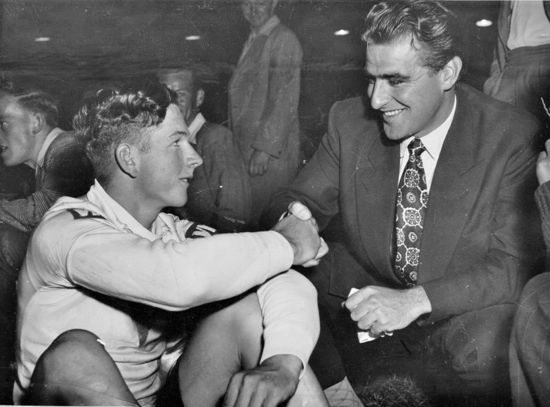 A double thrill for 17 year old Doug Jennings, winning the Austral and being congratulated by Sid Patterson.