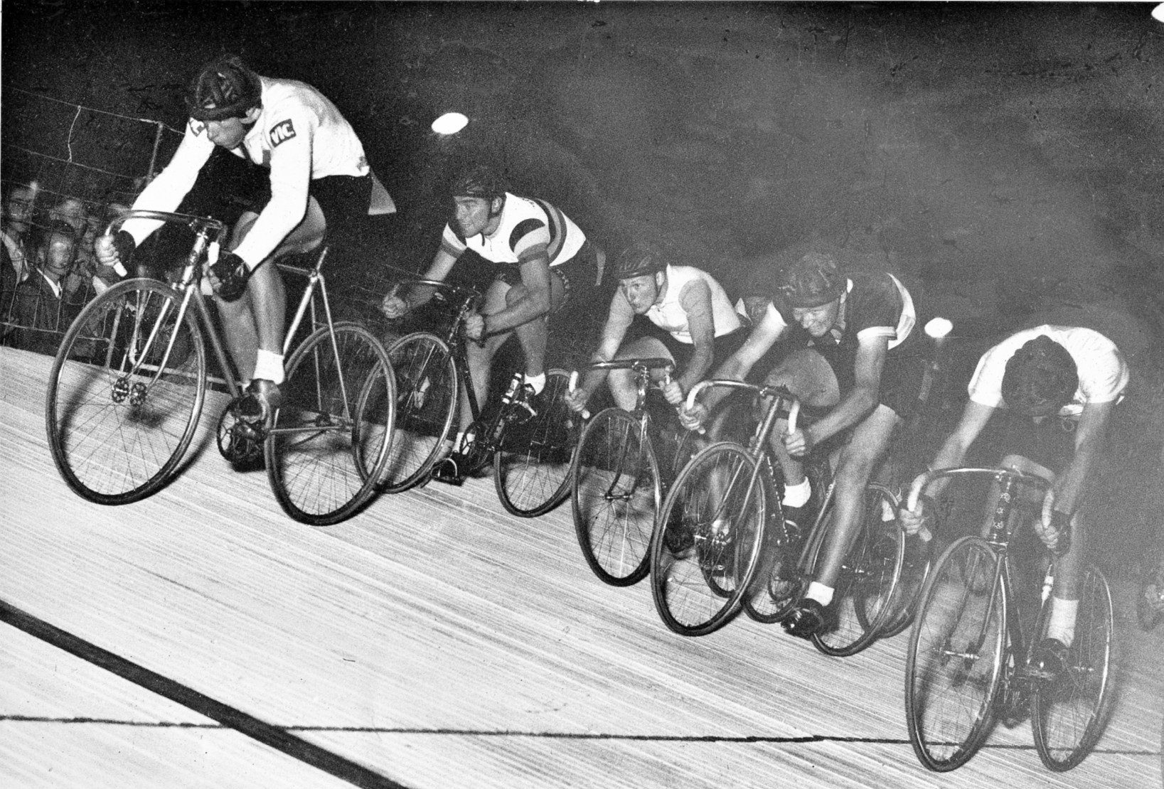 A most exciting finish to the 1952 Austral with Doug Jennings about to hit the line with a wall of riders behind. From the top, Sid Patterson 4th., Bob Main, Geoff McKay 3rd., Vin Nuttall 2nd.