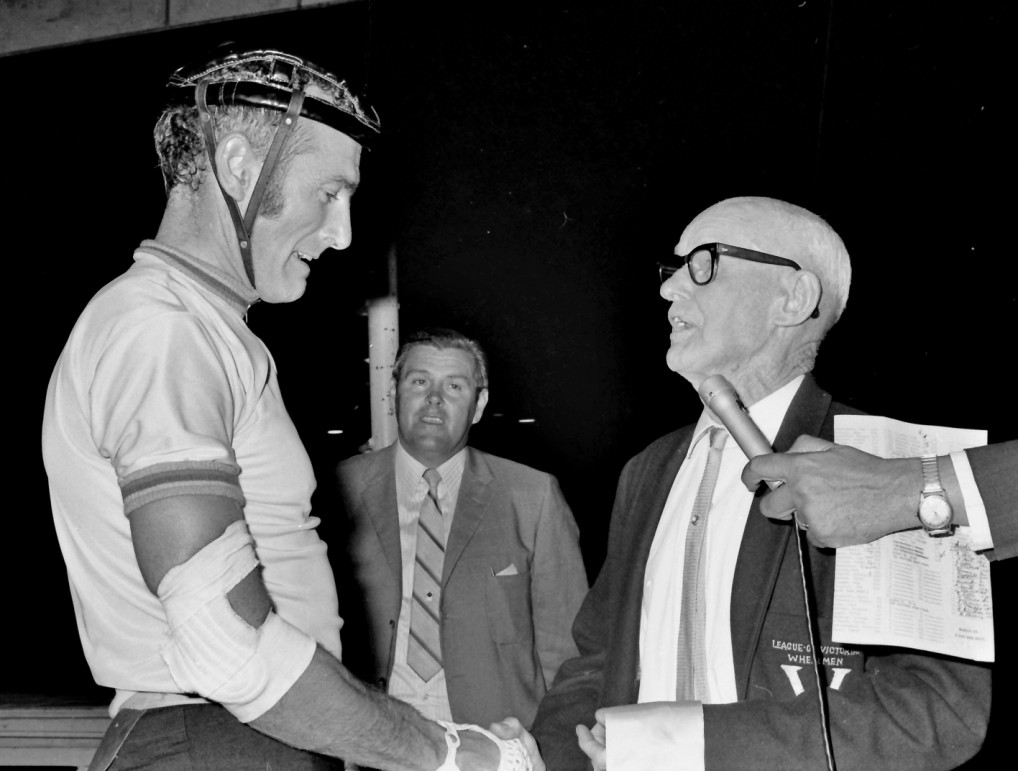 A historic touch to the presentation being made by Iddo 'Snowy' Munro who rode fastest time in the 1909 Warrnambool and beat the train by five minutes. Promoter Bill Long in the background.