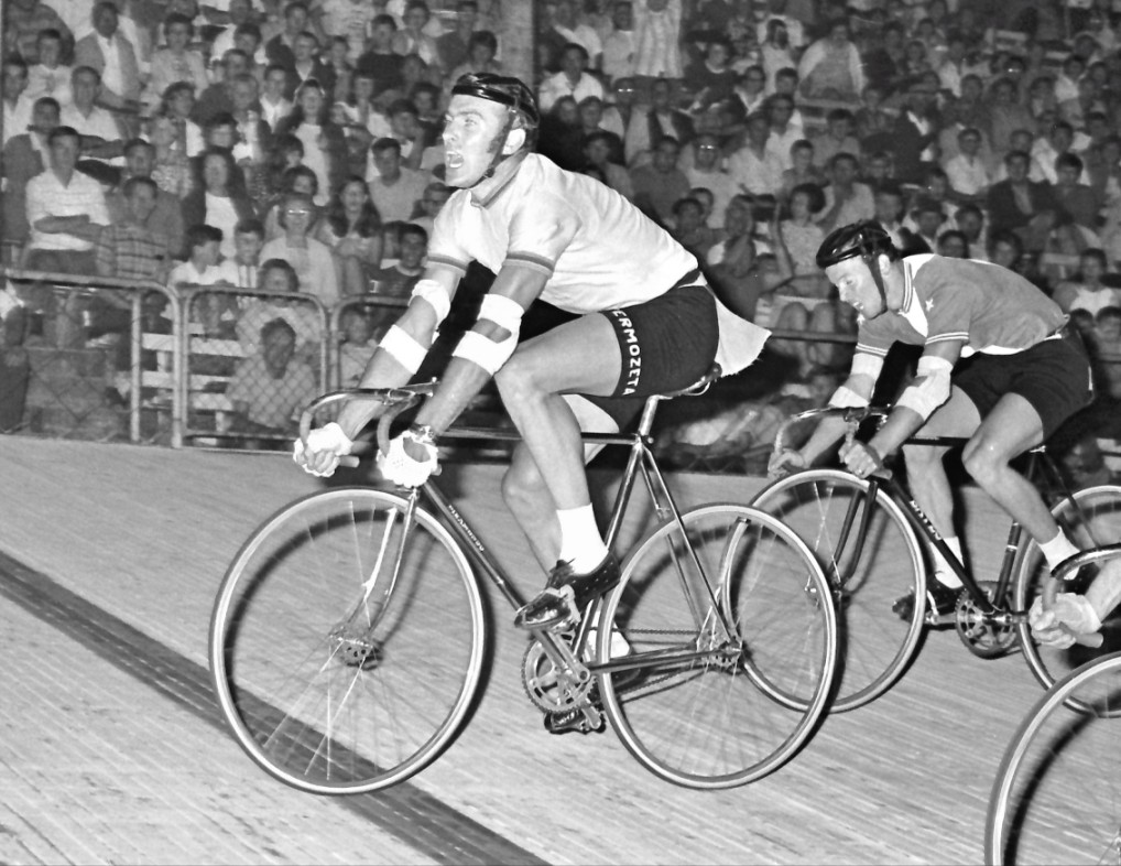 In 1970, Bill Stevens from Bendigo riding from 135 yards wins the last Austral to be held at the Olympic Velodrome. The wheel inside belongs to Gordon Maloney taking 2nd and on top is Geoff Edmonds, third.