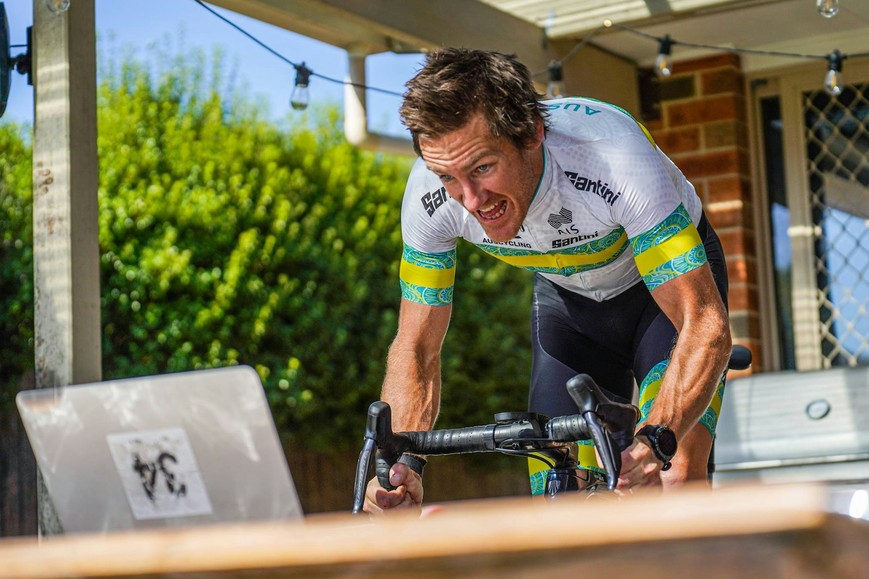Ben Hill riding on an esports platform at his house in Canberra. Picture: Flynn Hopkins/AusCycling