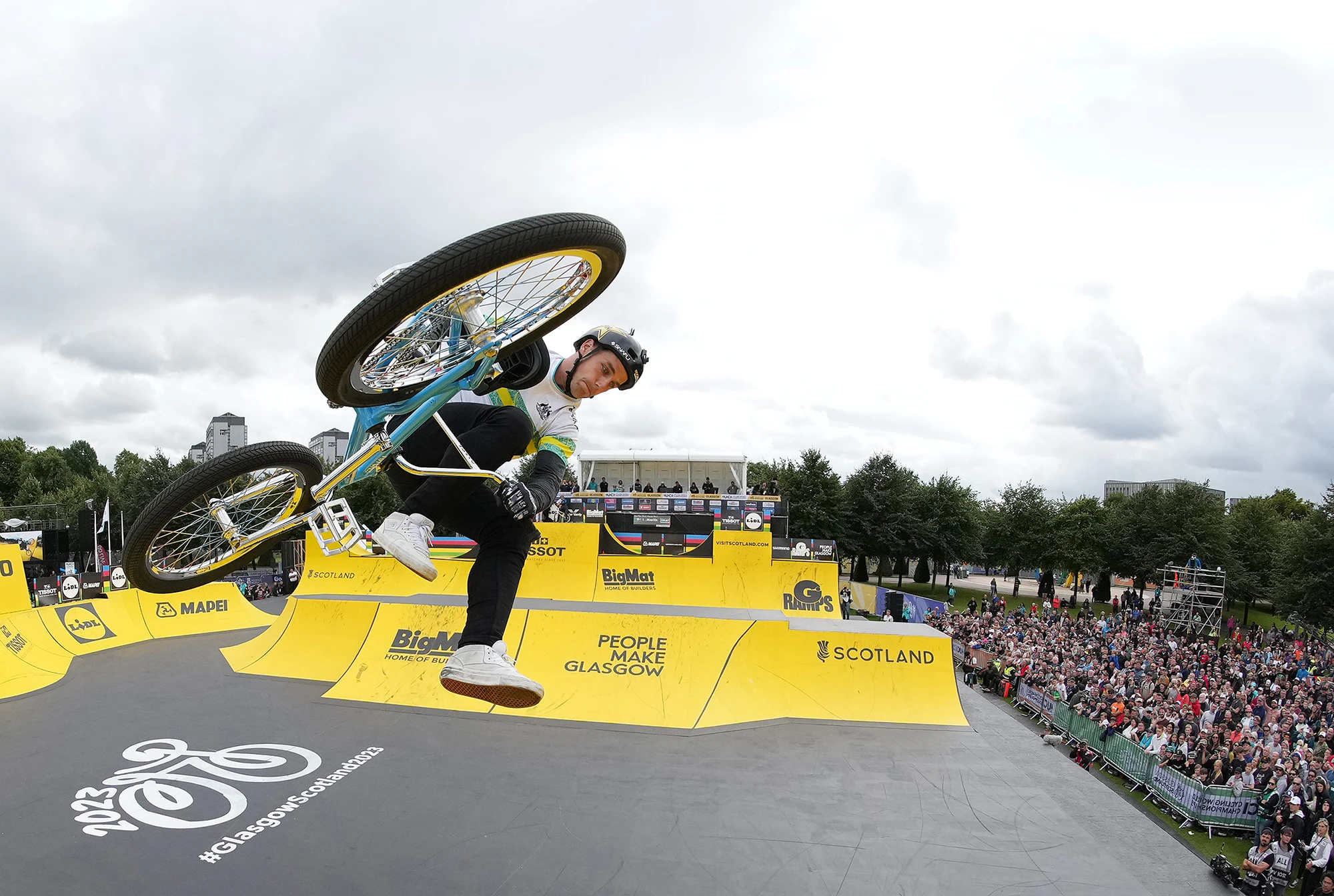 BMX freestyle rider performing trick in mid air