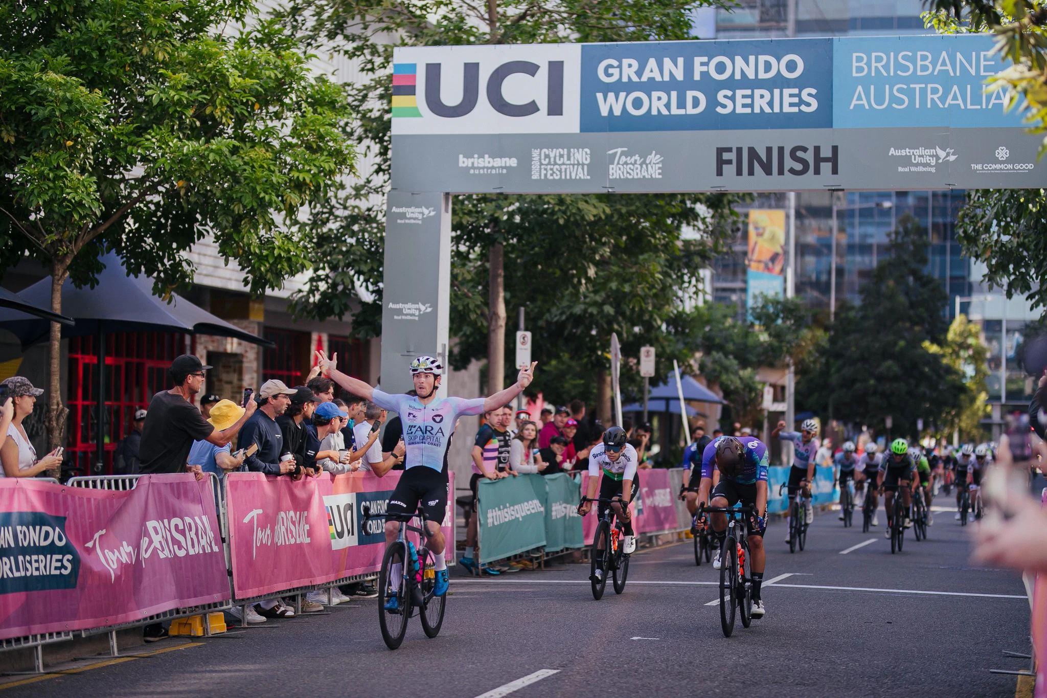 Brady Gilmore celebrates winning the 2023 National Road Series Tour de Brisbane one-day classic. Picture: Cassidy Cloupet.