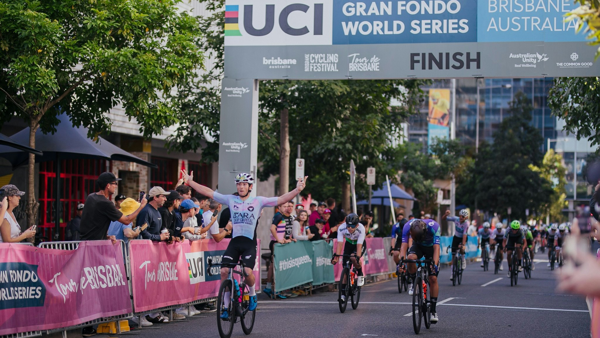 Brady Gilmore celebrates winning the 2023 National Road Series Tour de Brisbane one-day classic. Picture: Cassidy Cloupet.