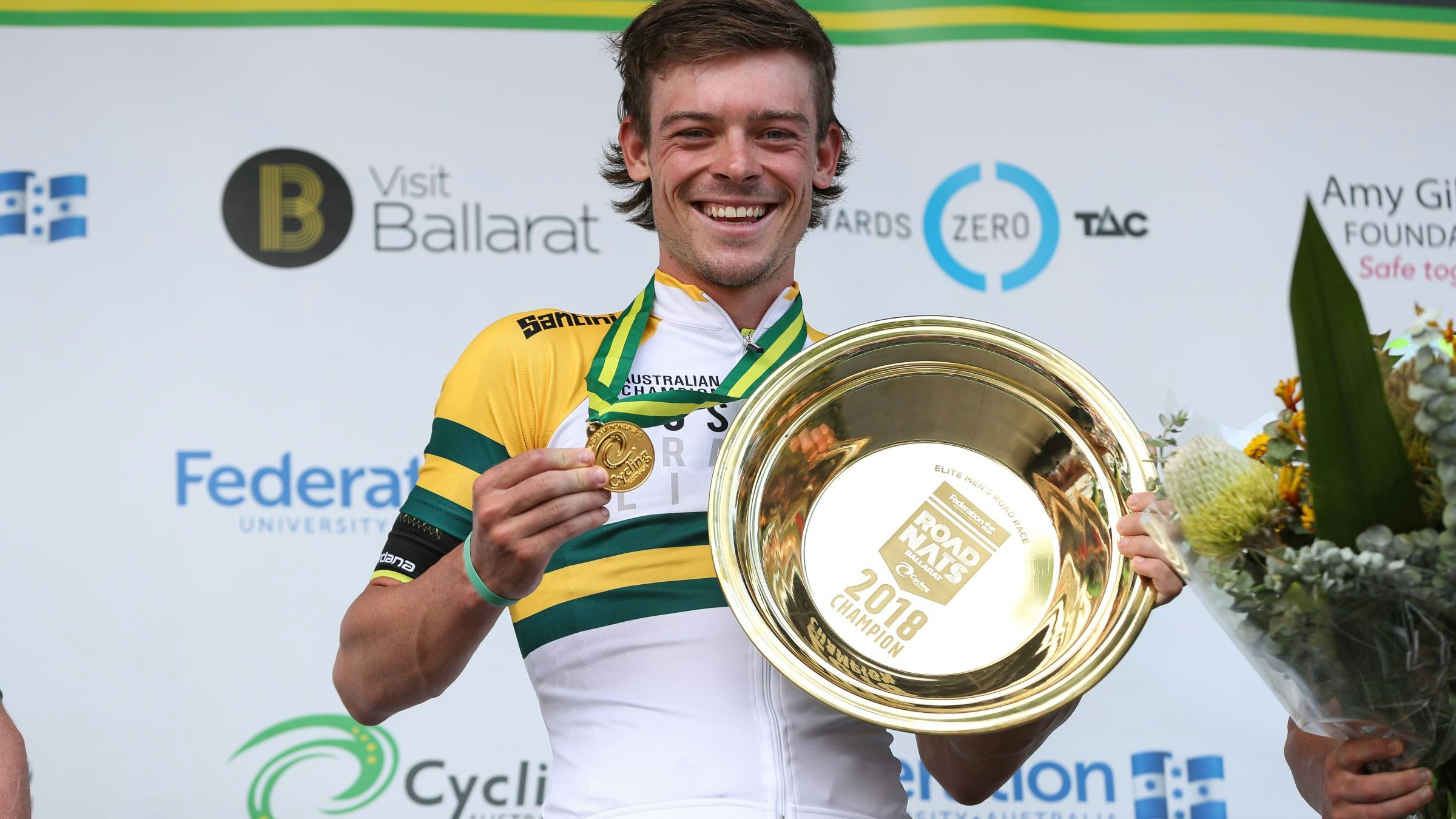 Alex Edmondson poses with gold medal, green and gold jersey and gold plate as the 2018 road race national champion in Ballarat. Con Chronis