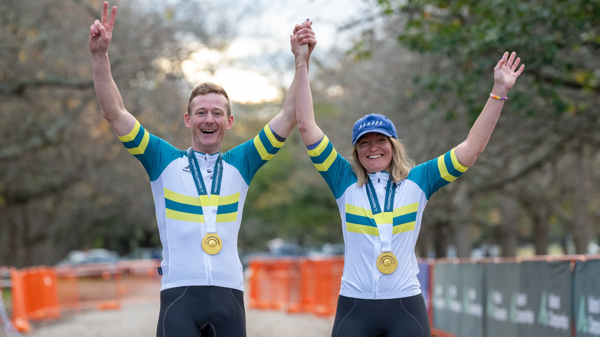 Husband and wife from Bright, Victoria Fiona Morris and Garry Millburn celebrate together in the Australian national champion's jerseys and gold medals after winning the 2026 AusCycling Cyclo-cross National Championships in Ballarat, Victoria.