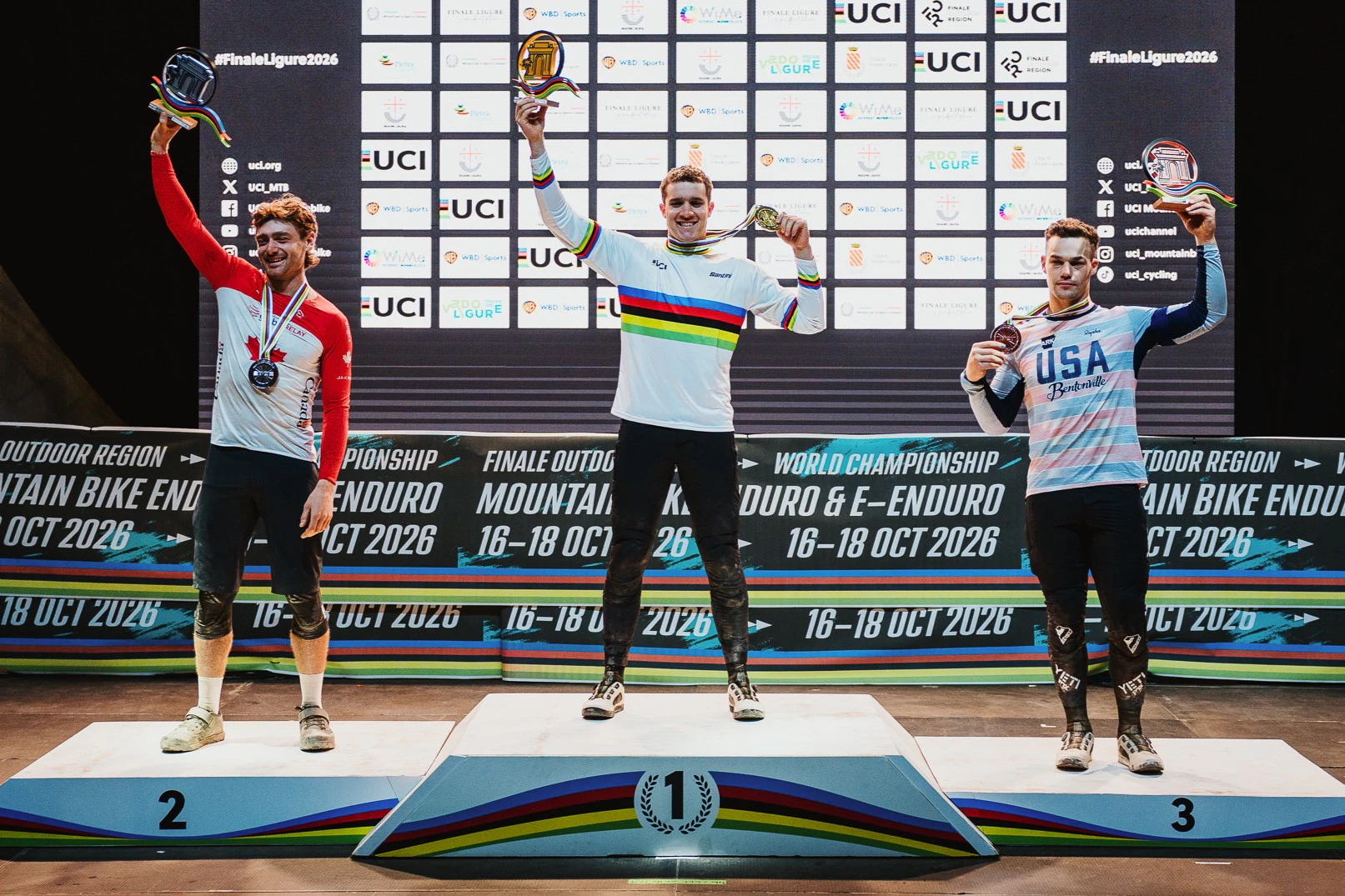 Ryan Gilchrist of the ARA Australian Cycling Team celebrates on the podium as winner of the 2026 UCI Enduro World Championships in Italy, Finale Ligure