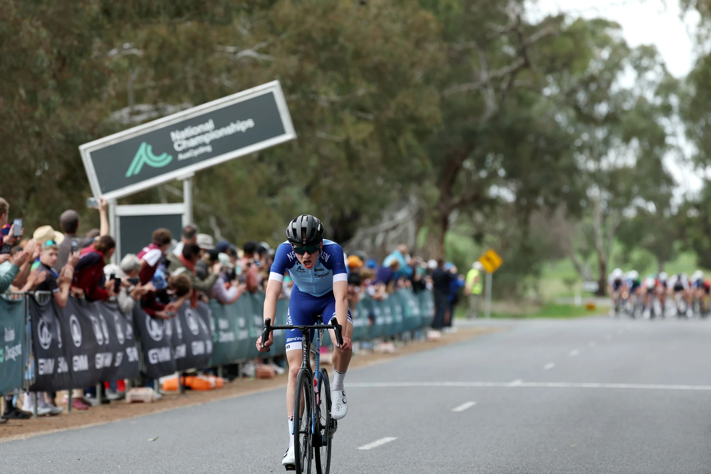 Hamish of New South Wales crosses the finish line at an AusCycling Junior Road National Championships