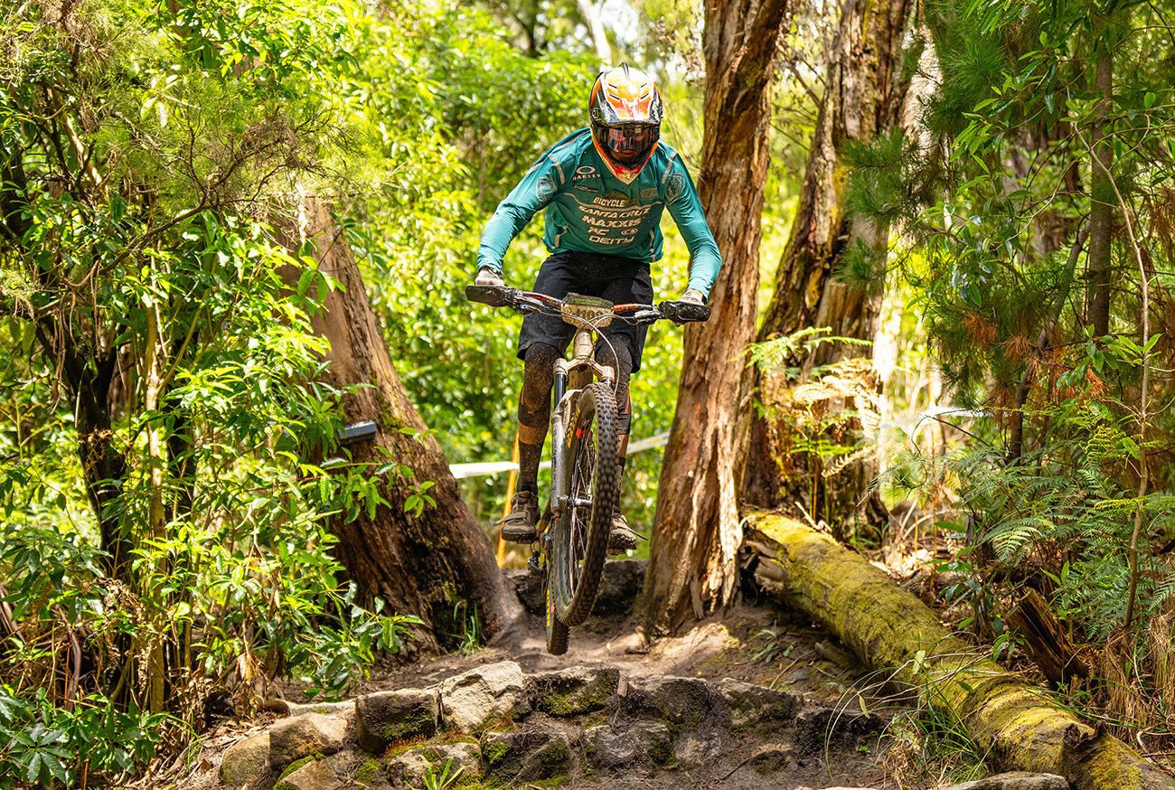 Mountain bike rider riding through course